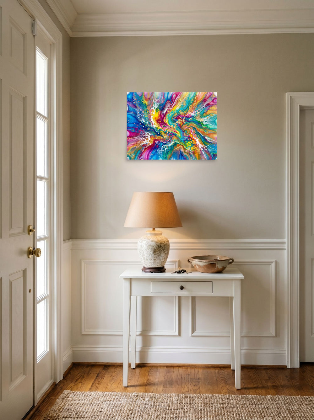 A 24x18 inch unframed paper Abstract art print of 'Rainbow Burst' hanging in an entryway near a console.