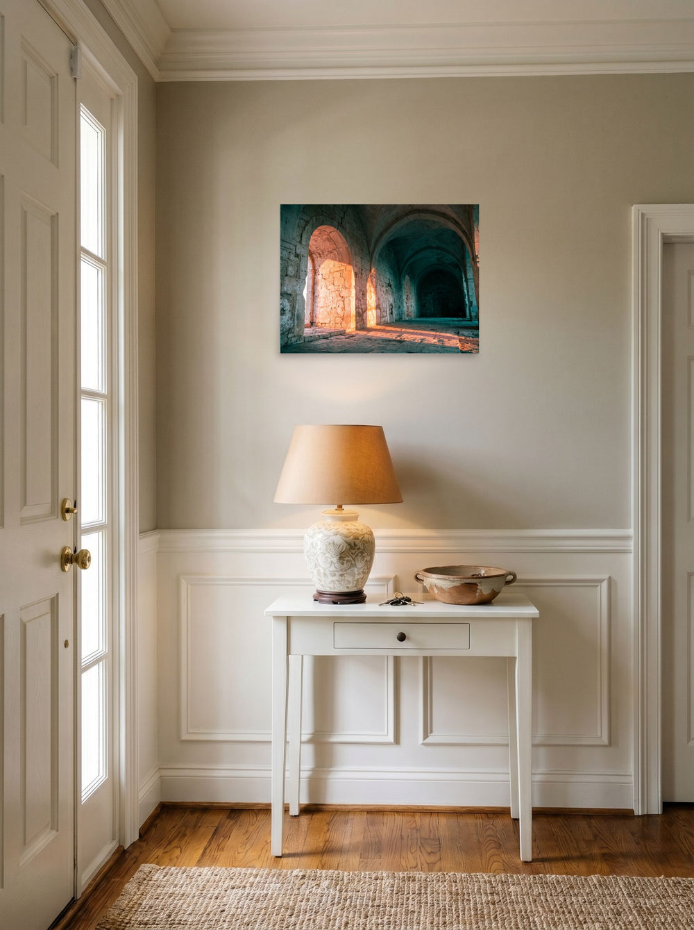 A 24x18 inch unframed paper Art photography print of 'Arches at Sunset' hanging in an entryway near a console.