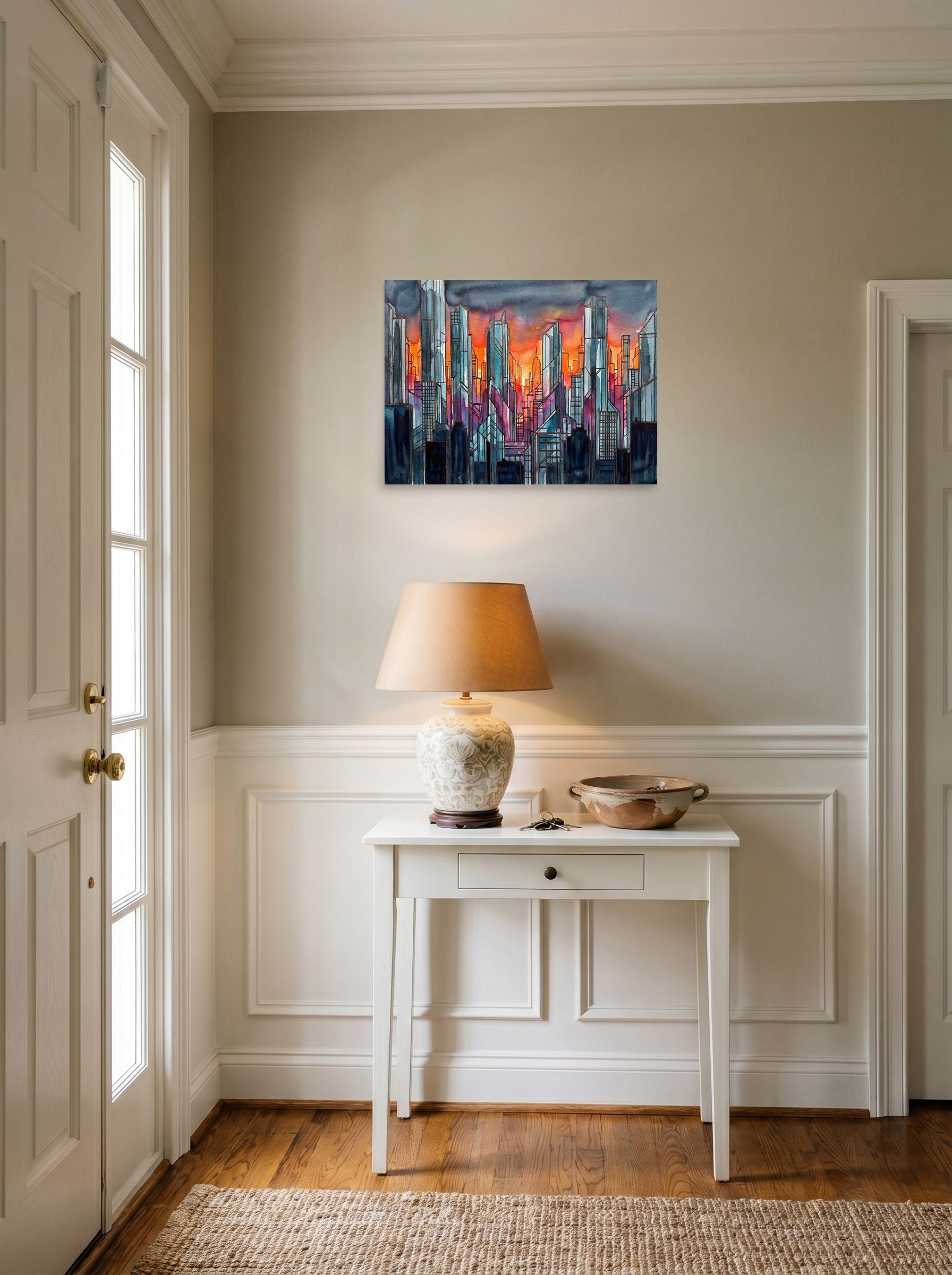 A 24x18 inch unframed paper Cubism,Abstract expressionism print of 'City Skyline' hanging in an entryway near a console.