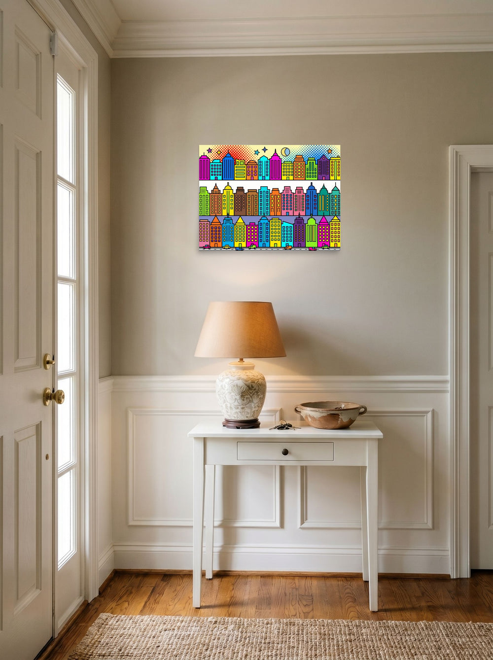 A 24x18 inch unframed paper Pop art print of 'Bright City Blocks' hanging in an entryway near a console.