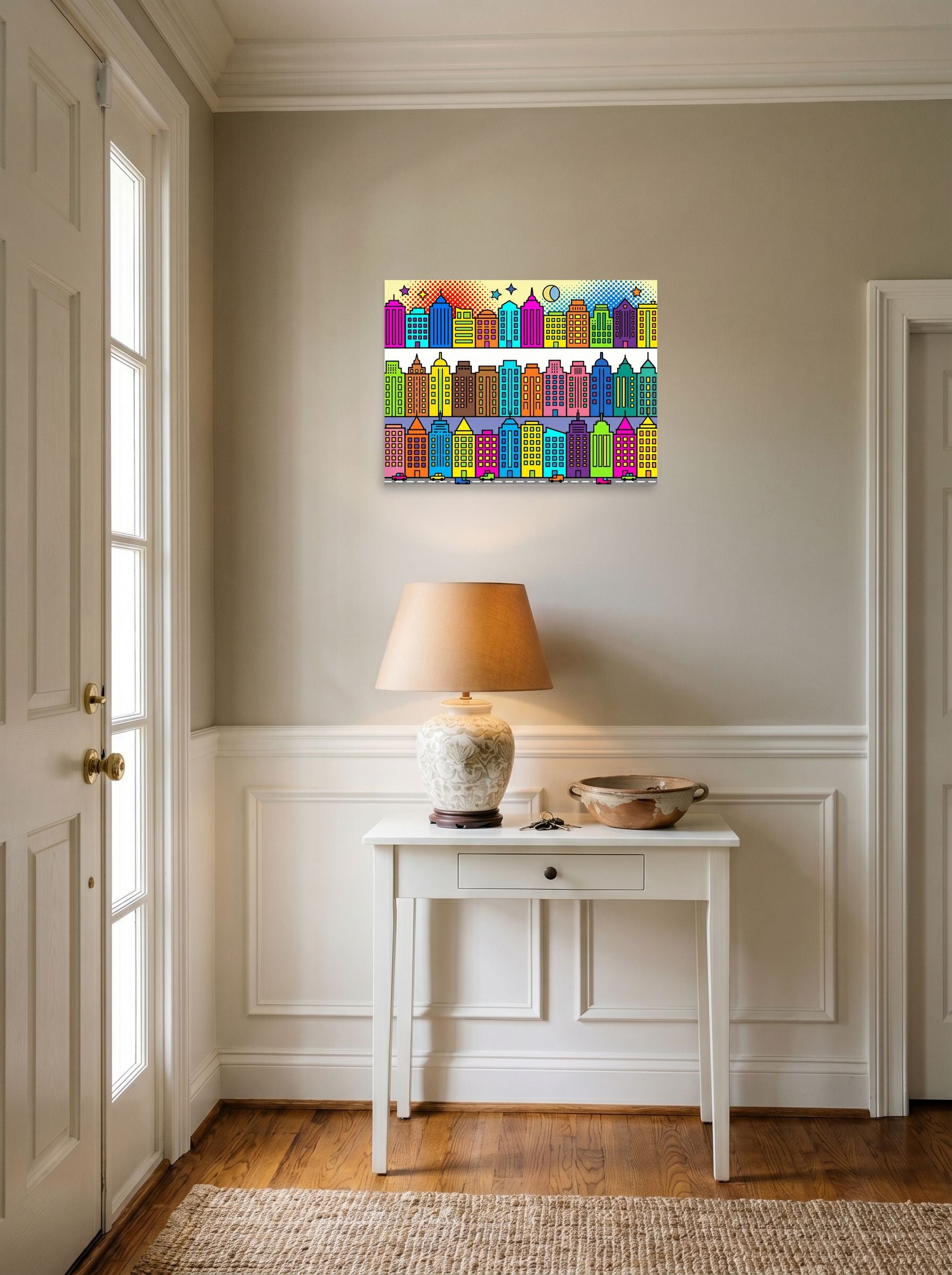 A 24x18 inch unframed paper Pop art print of 'Bright City Blocks' hanging in an entryway near a console.