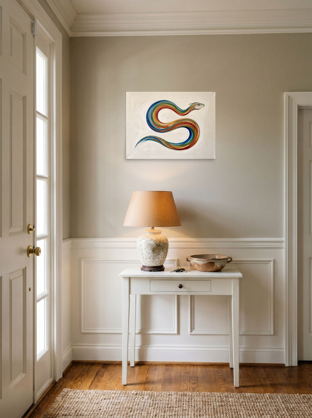 The unframed paper print 'Path of the Rainbow Serpent' hanging in an entryway near a console, shown at 24x18 inch.