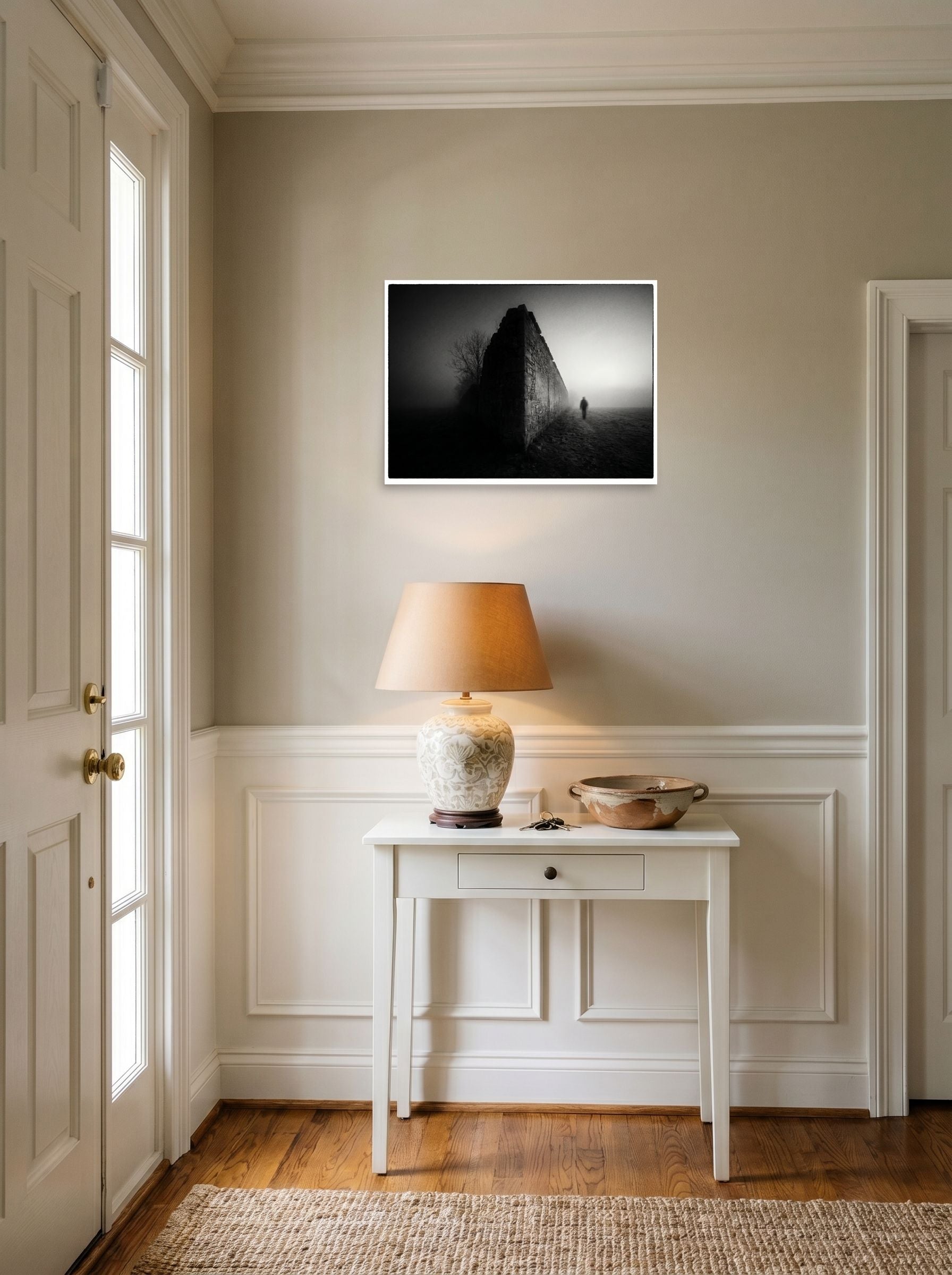 A 24x18 inch unframed paper Art photography print of 'Echoes in the Mist' hanging in an entryway near a console.