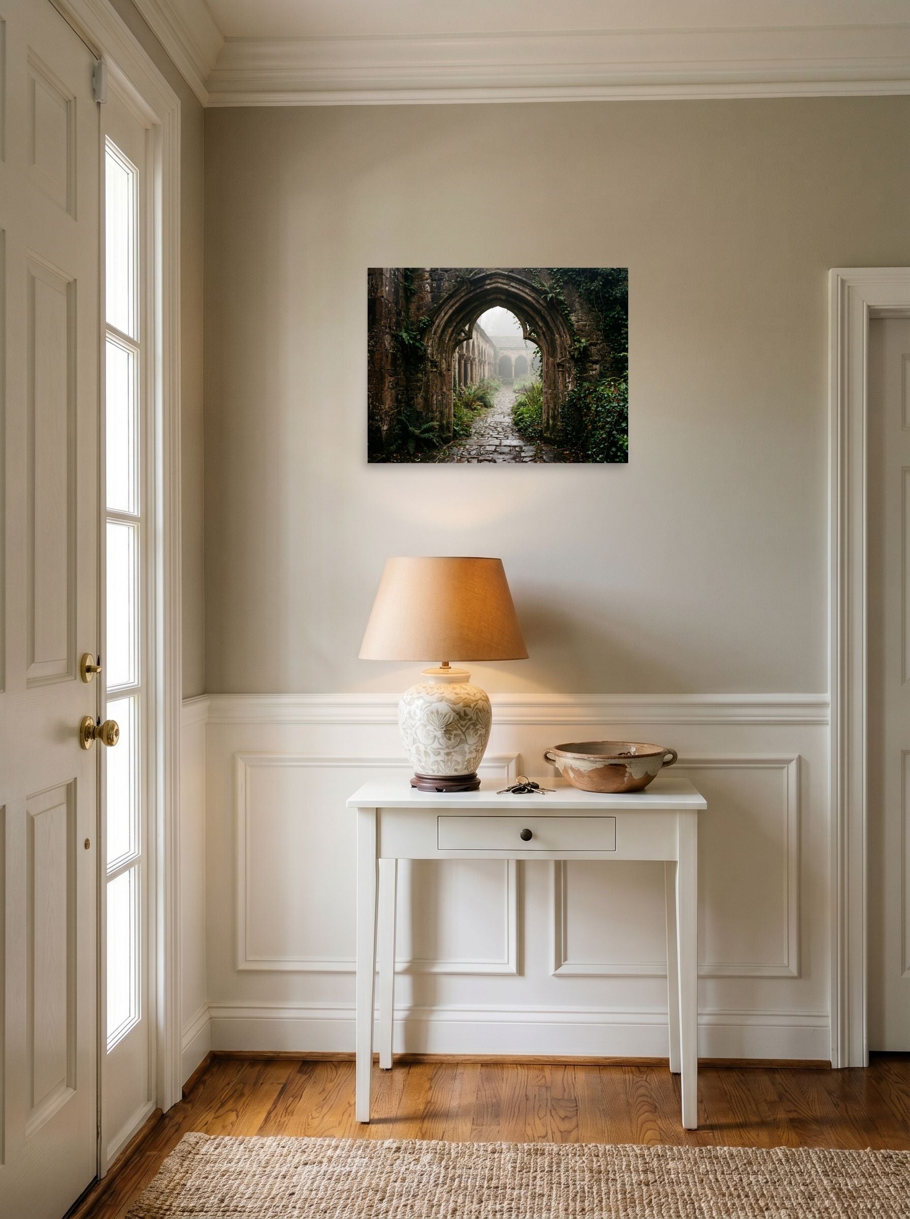 A 24x18 inch unframed paper Art photography print of 'The Forgotten Abbey' hanging in an entryway near a console.