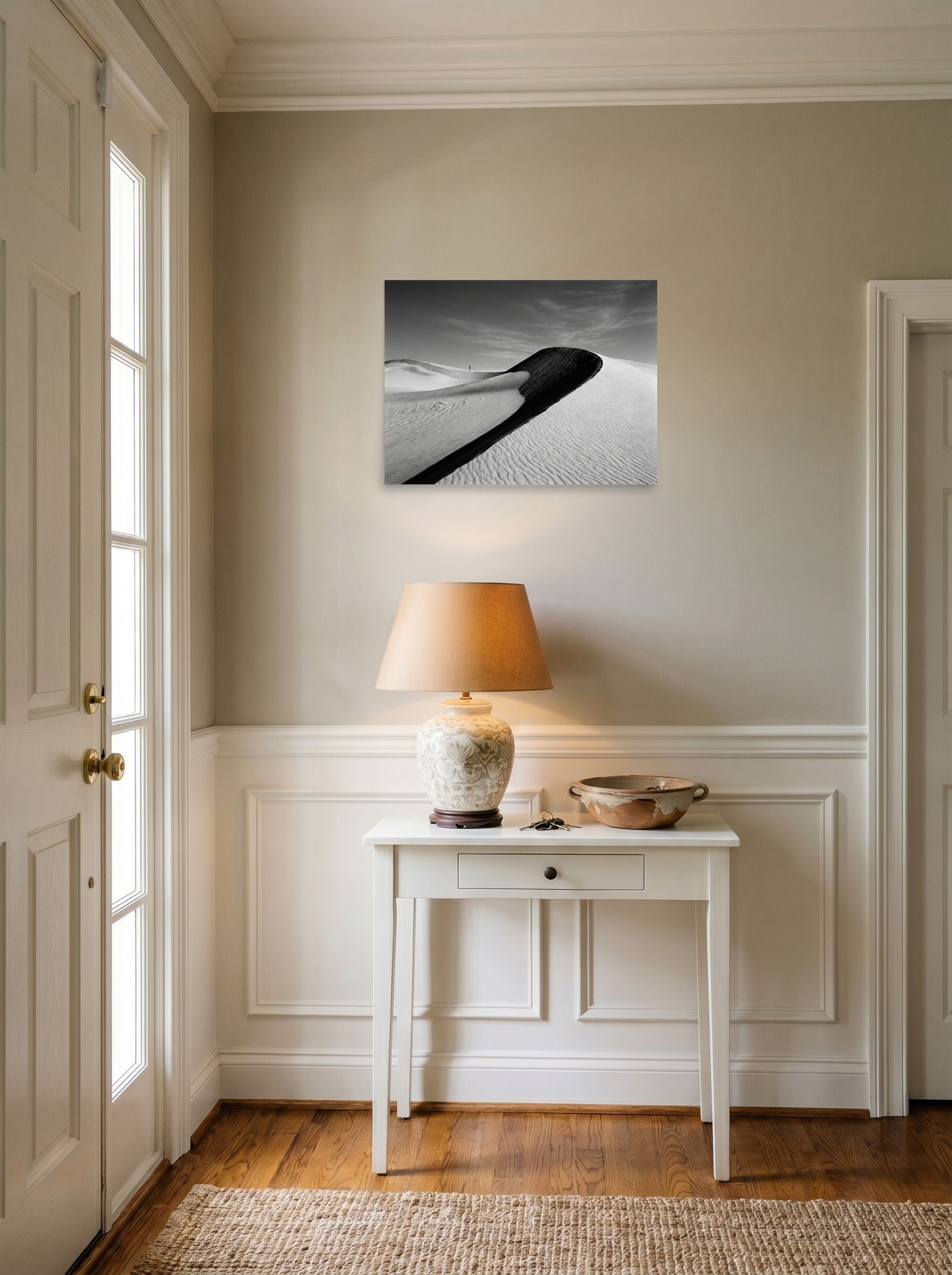 A 24x18 inch unframed paper Art photography print of 'Footsteps in the Void' hanging in an entryway near a console.