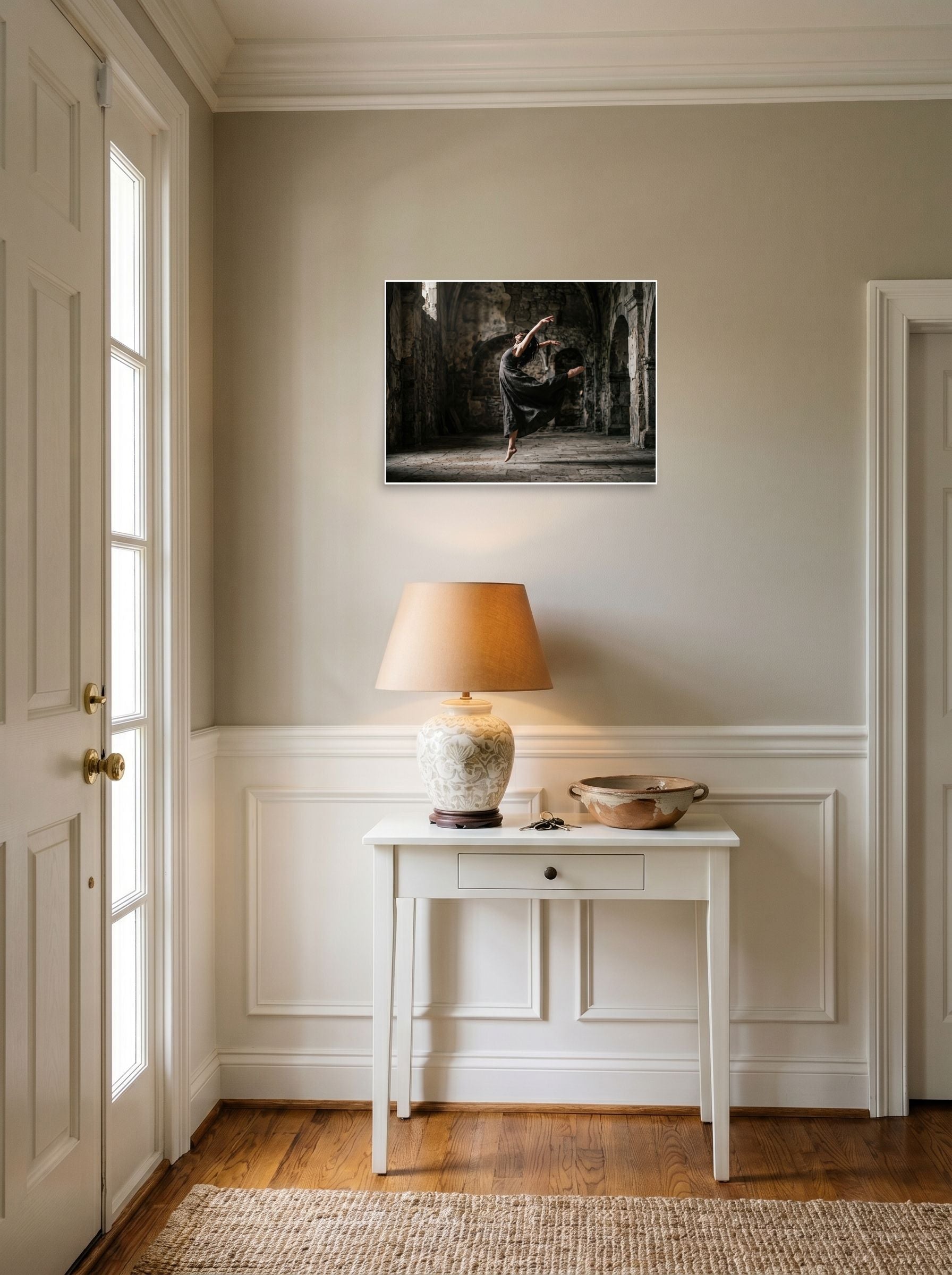 A 24x18 inch unframed paper Art photography print of 'Grace in the Ruins' hanging in an entryway near a console.