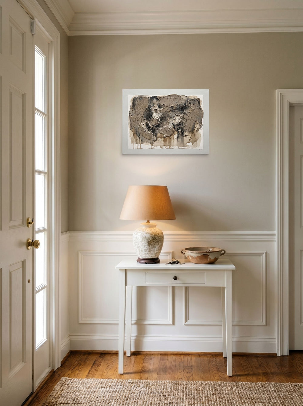 'Earth and Sgraffito' in 24x18 inch unframed paper, hanging in an entryway near a console.