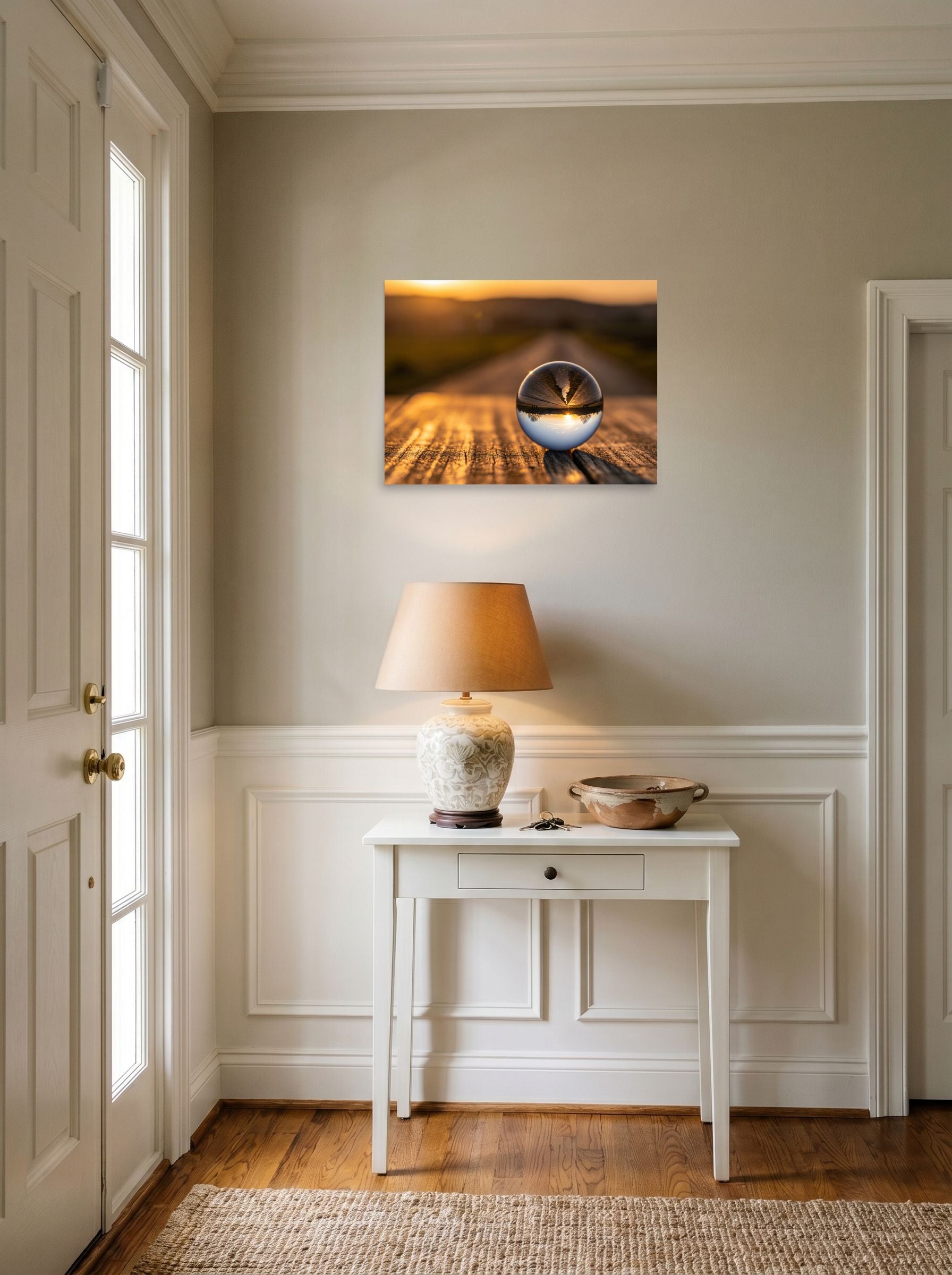 A 24x18 inch unframed paper Surrealism print of 'Inverted Sunset' hanging in an entryway near a console.
