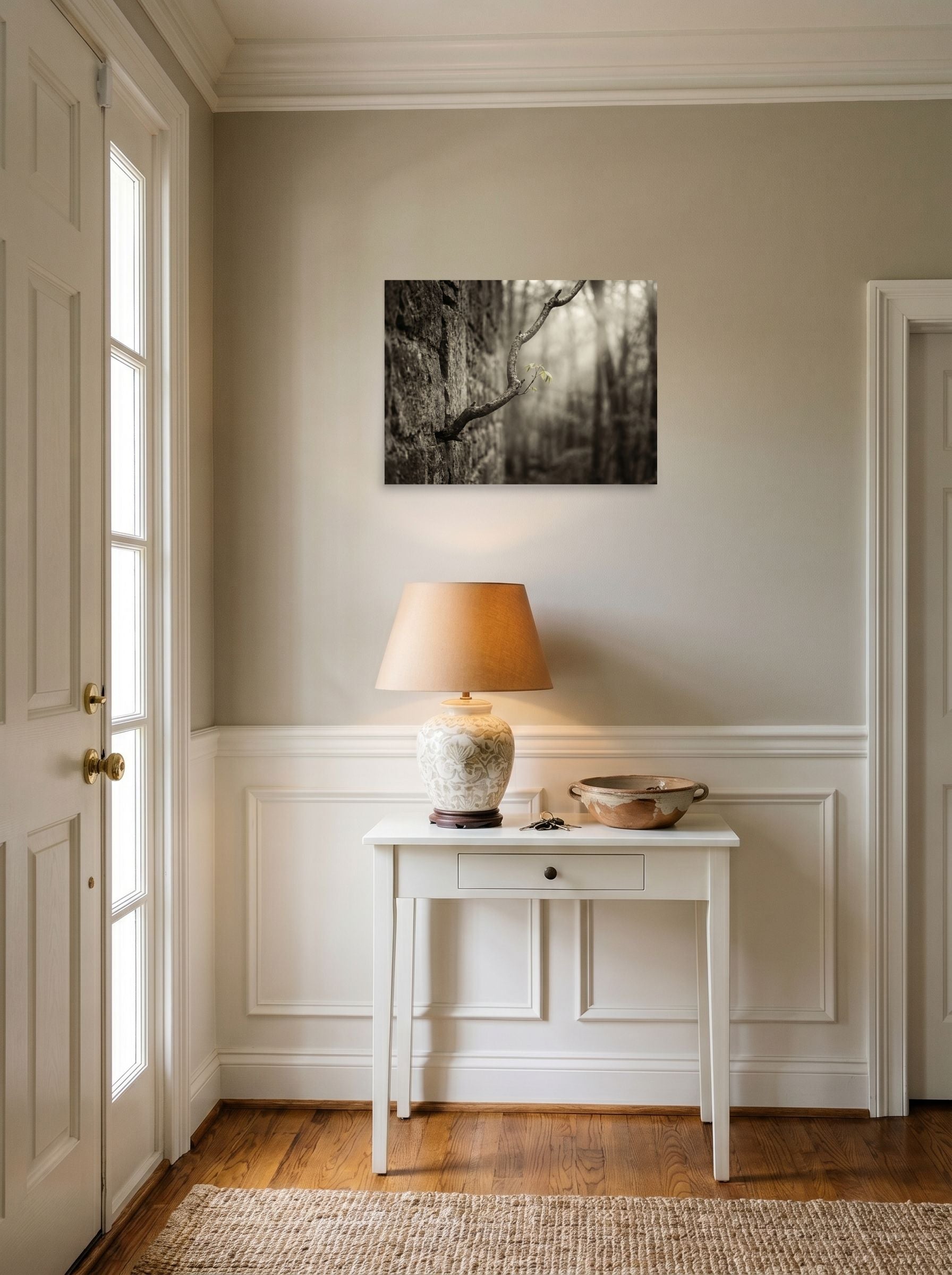 A 24x18 inch unframed paper Art photography print of 'Stone and Sprout' hanging in an entryway near a console.