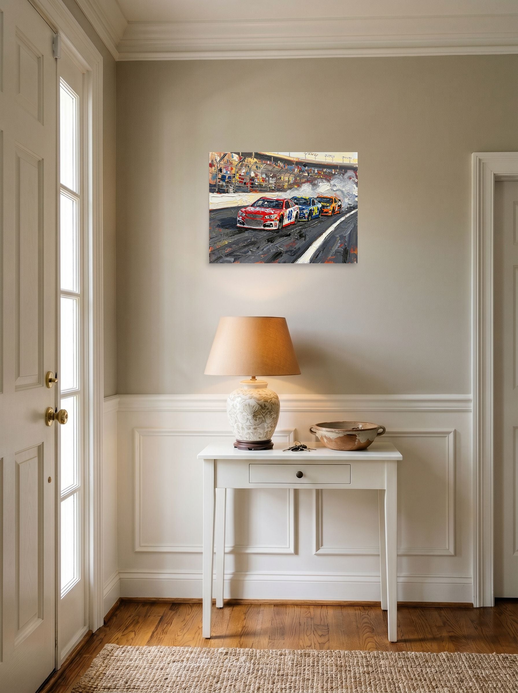A 24x18 inch unframed paper Expressionism print of 'Thunder on the Track' hanging in an entryway near a console.