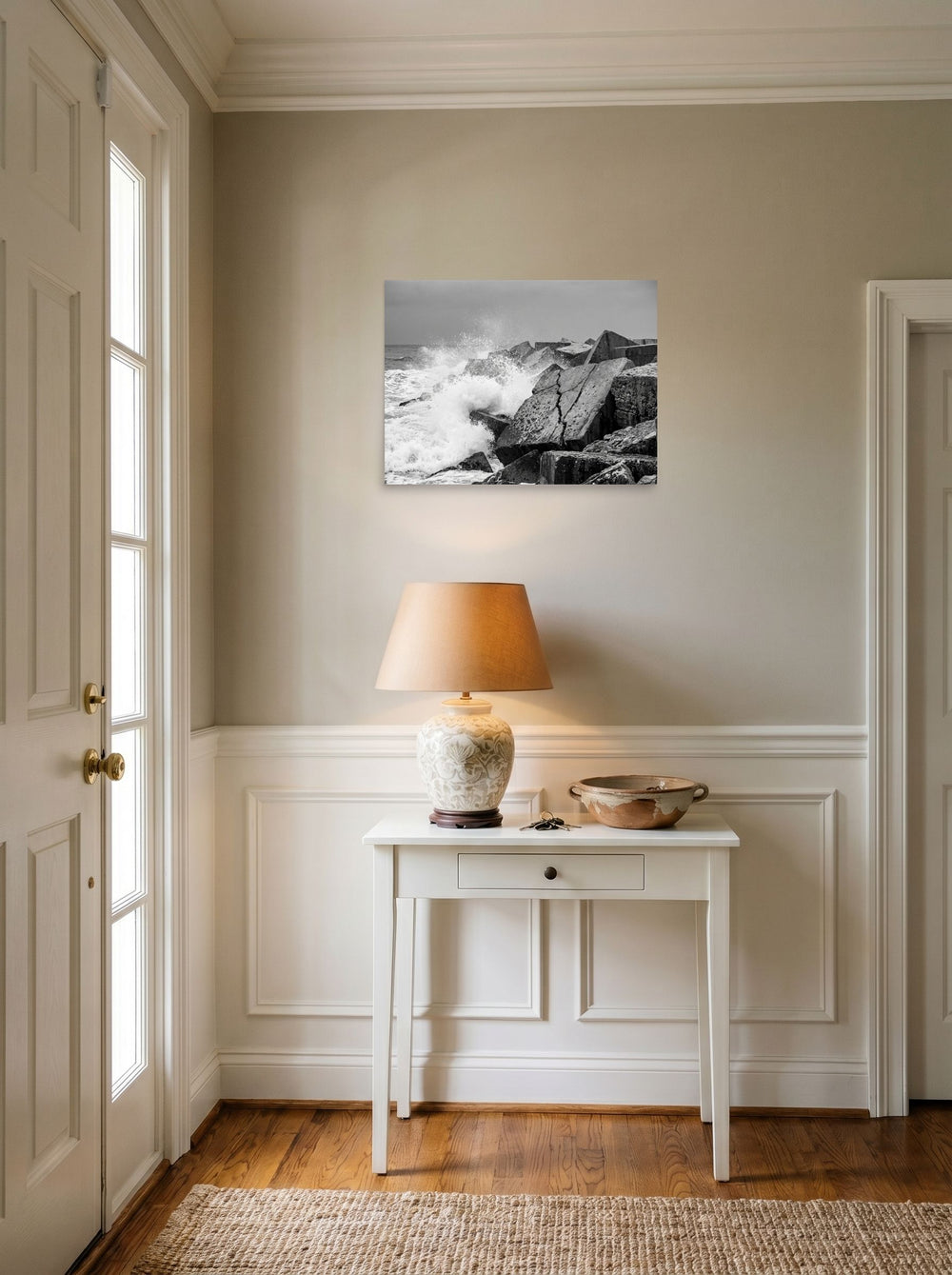 A 24x18 inch unframed paper Art photography print of 'Breakwater Surge' hanging in an entryway near a console.