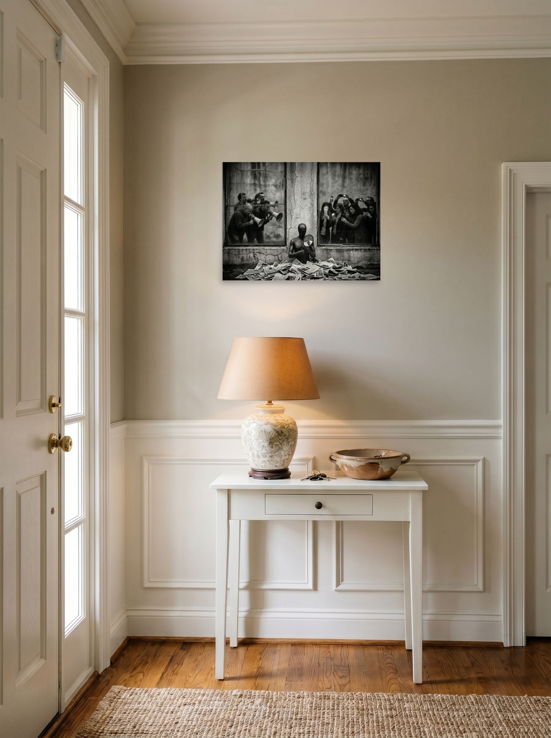 A 24x18 inch unframed paper Surrealism print of 'The Spectacle' hanging in an entryway near a console.