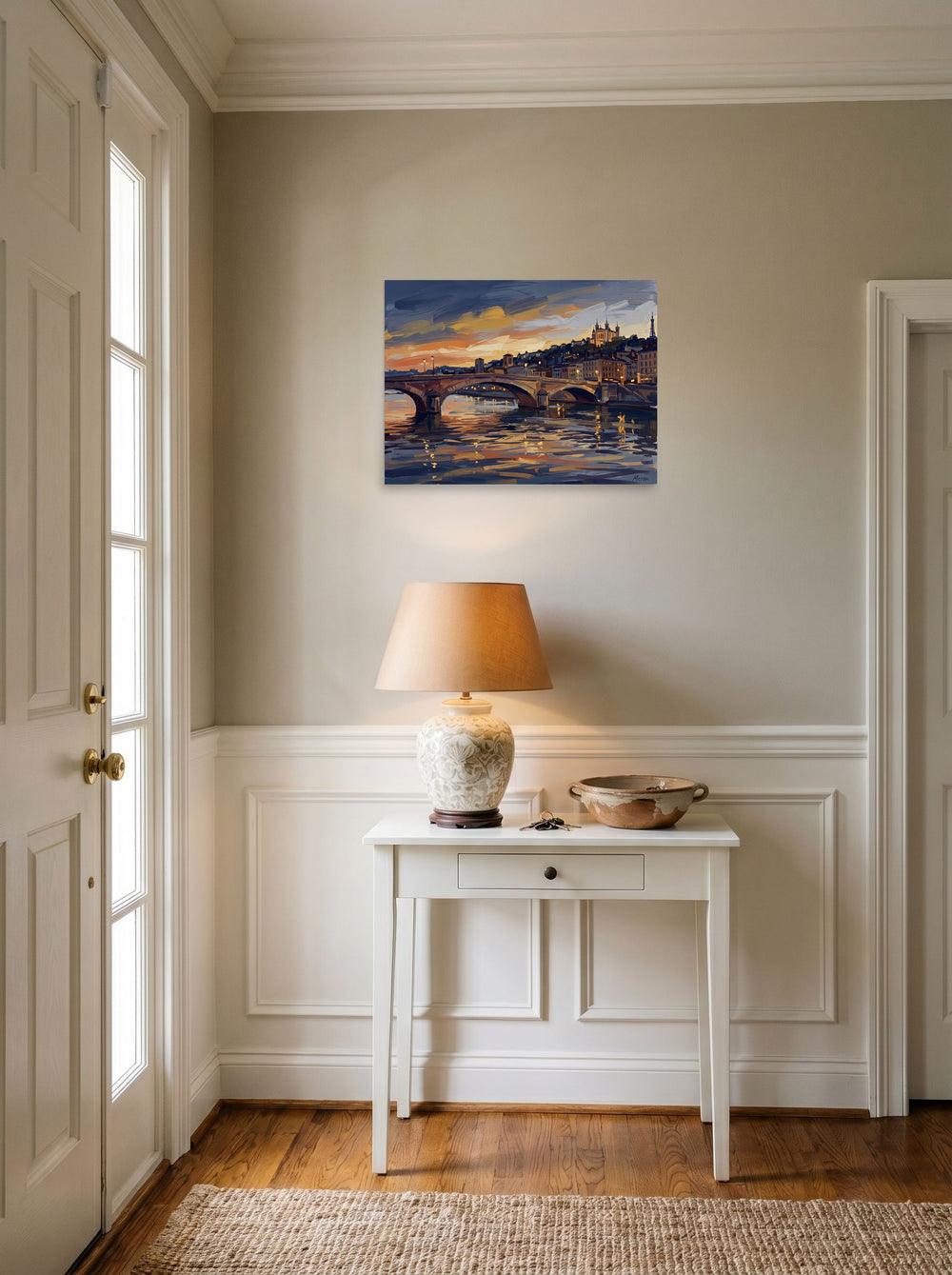 A 24x18 inch unframed paper Impressionism print of 'Dusk Over Lyon' hanging in an entryway near a console.