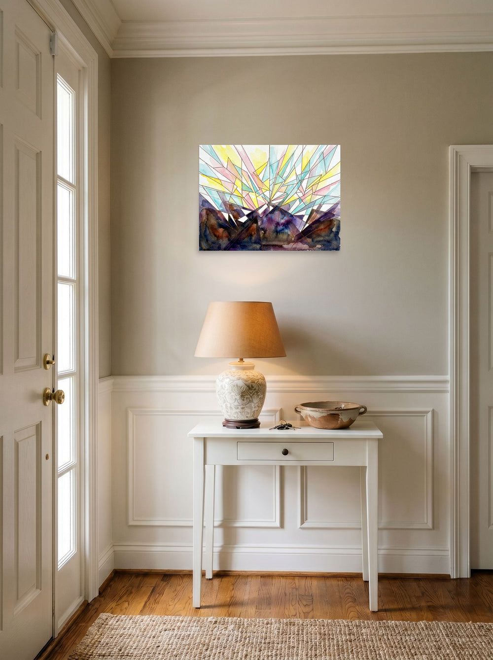 A 24x18 inch unframed paper Geometric abstract art print of 'Symphony' hanging in an entryway near a console.