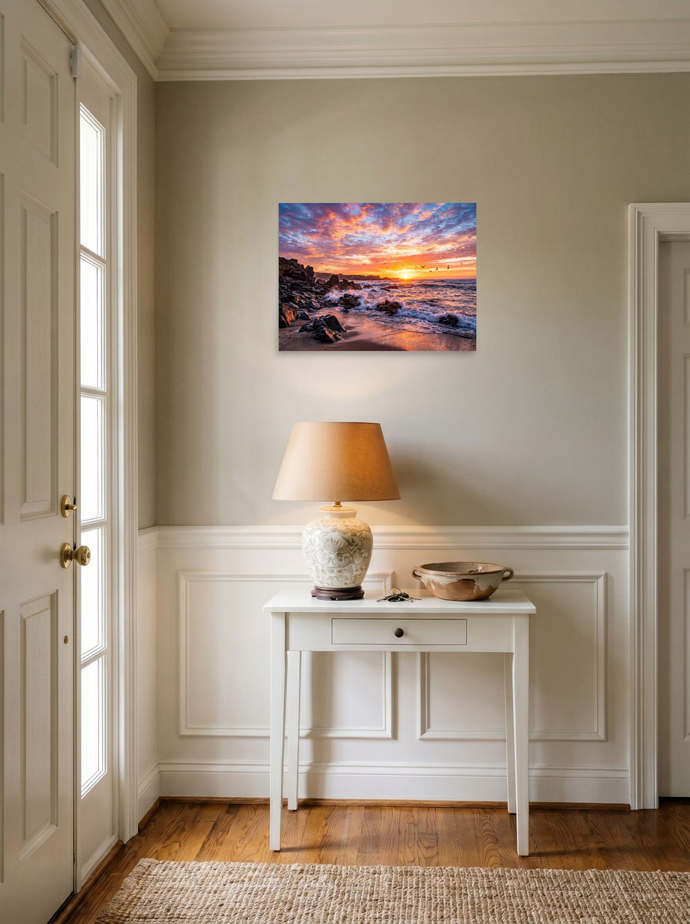 A 24x18 inch unframed paper Art photography print of 'Coastal Fire' hanging in an entryway near a console.