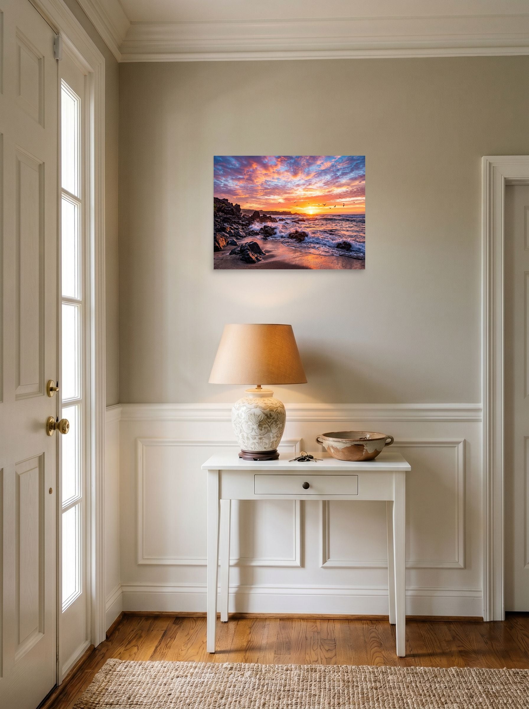 A 24x18 inch unframed paper Art photography print of 'Coastal Fire' hanging in an entryway near a console.