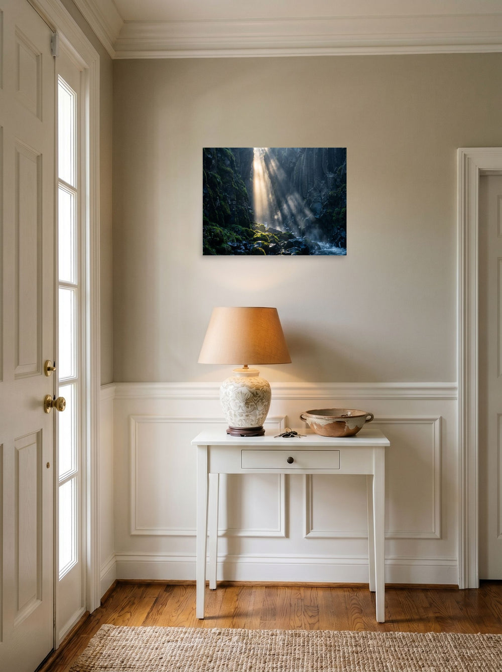 A 24x18 inch unframed paper Art photography print of 'Sunbeams in the Gorge' hanging in an entryway near a console.