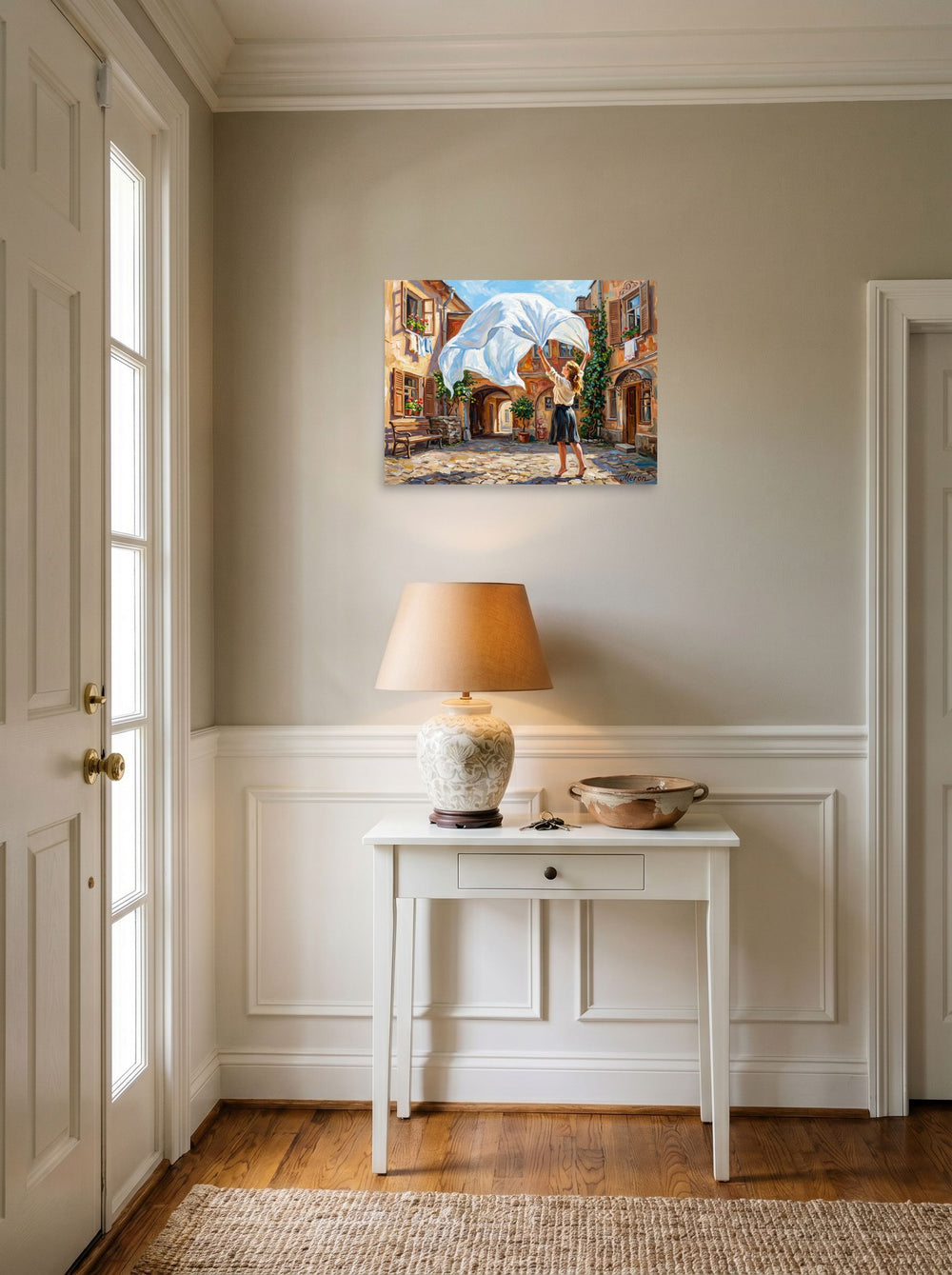 A 24x18 inch unframed paper Impressionism print of 'The White Sheet' hanging in an entryway near a console.
