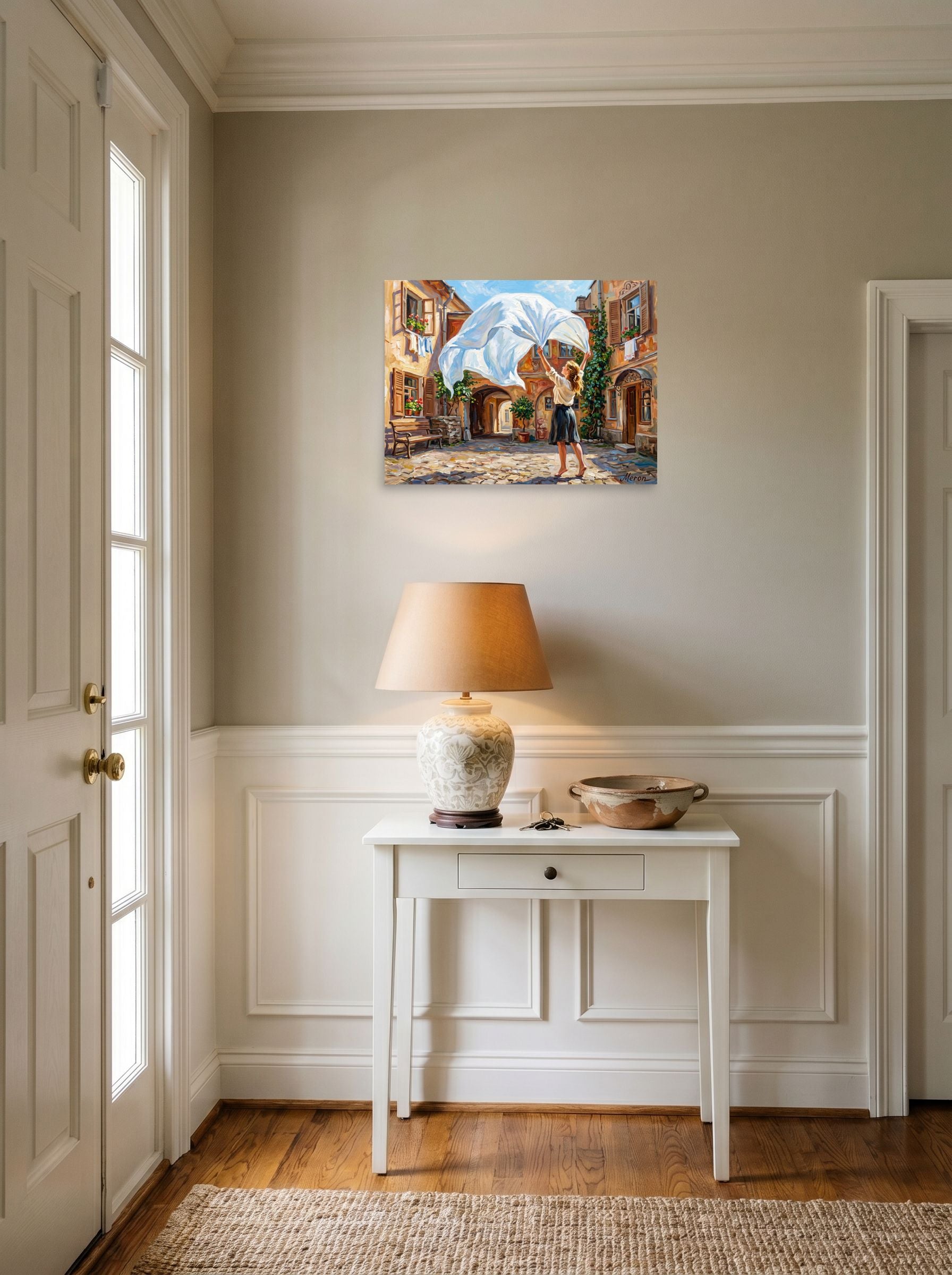 A 24x18 inch unframed paper Impressionism print of 'The White Sheet' hanging in an entryway near a console.