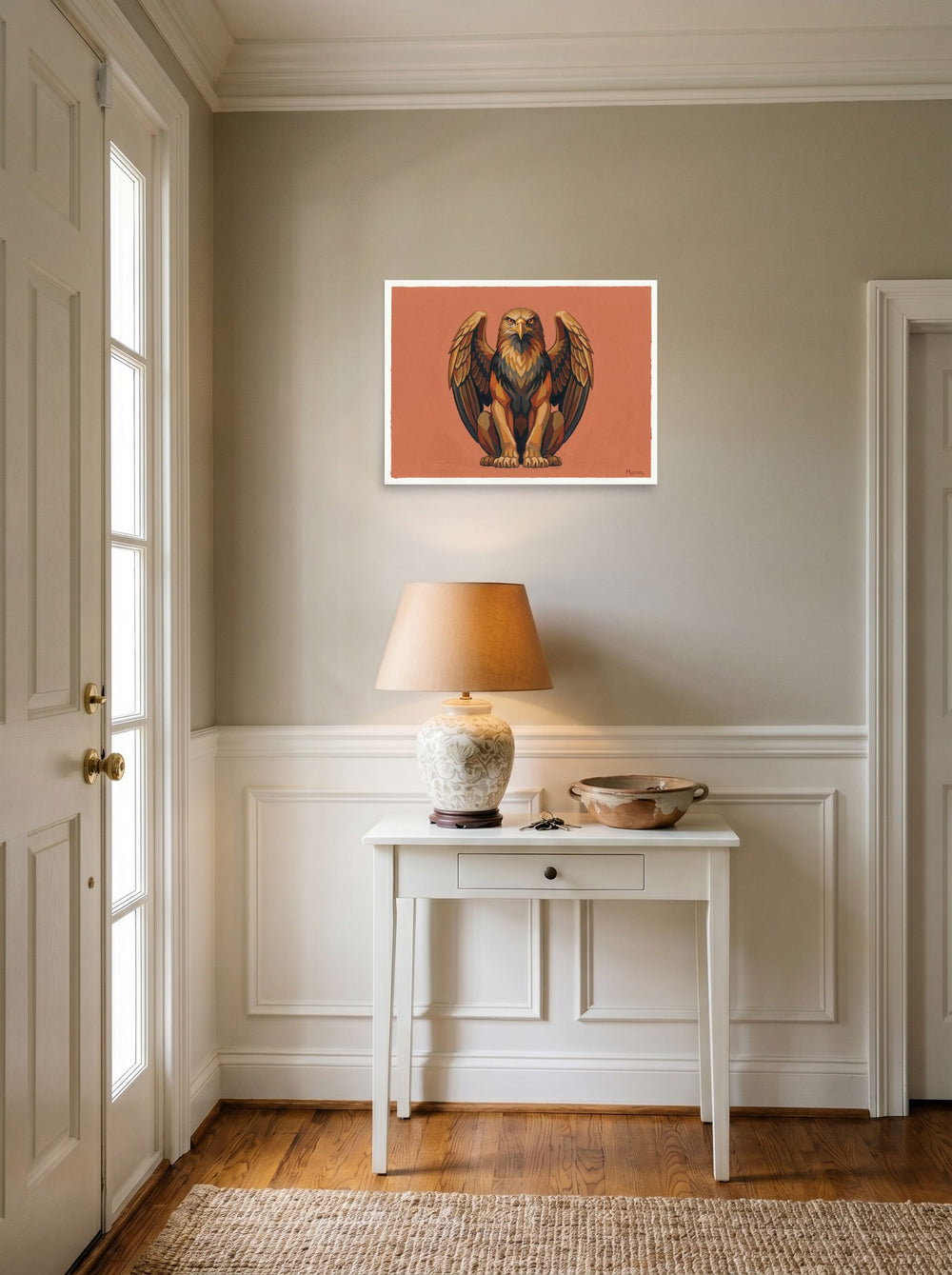 A 24x18 inch unframed paper Art Deco print of 'The Golden Griffin' hanging in an entryway near a console.