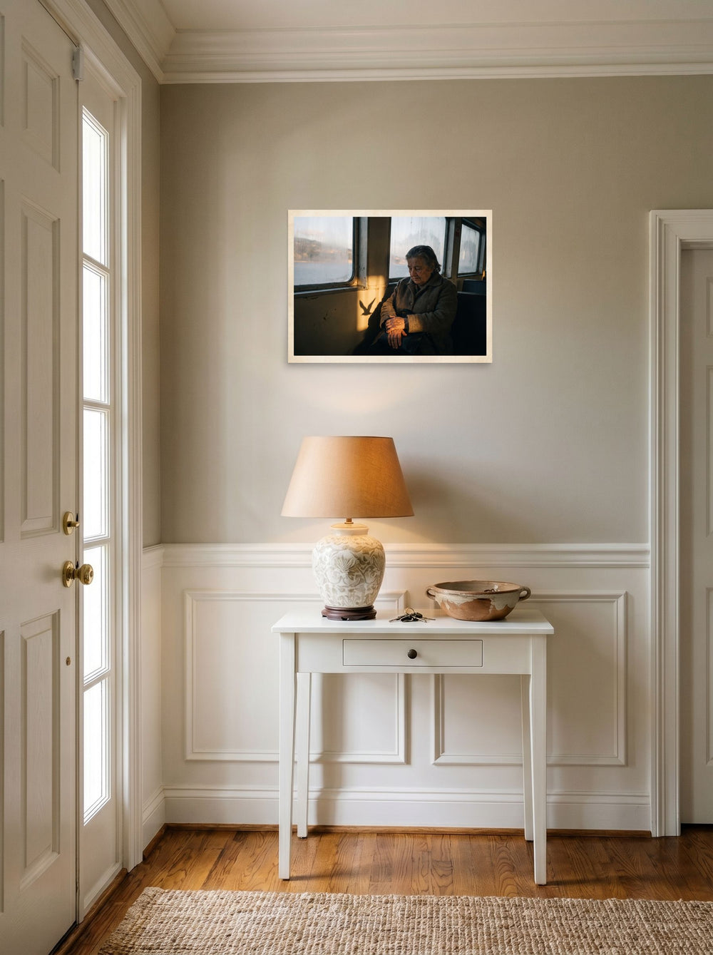A 24x18 inch unframed paper Art photography print of 'Shadow of the Gull' hanging in an entryway near a console.