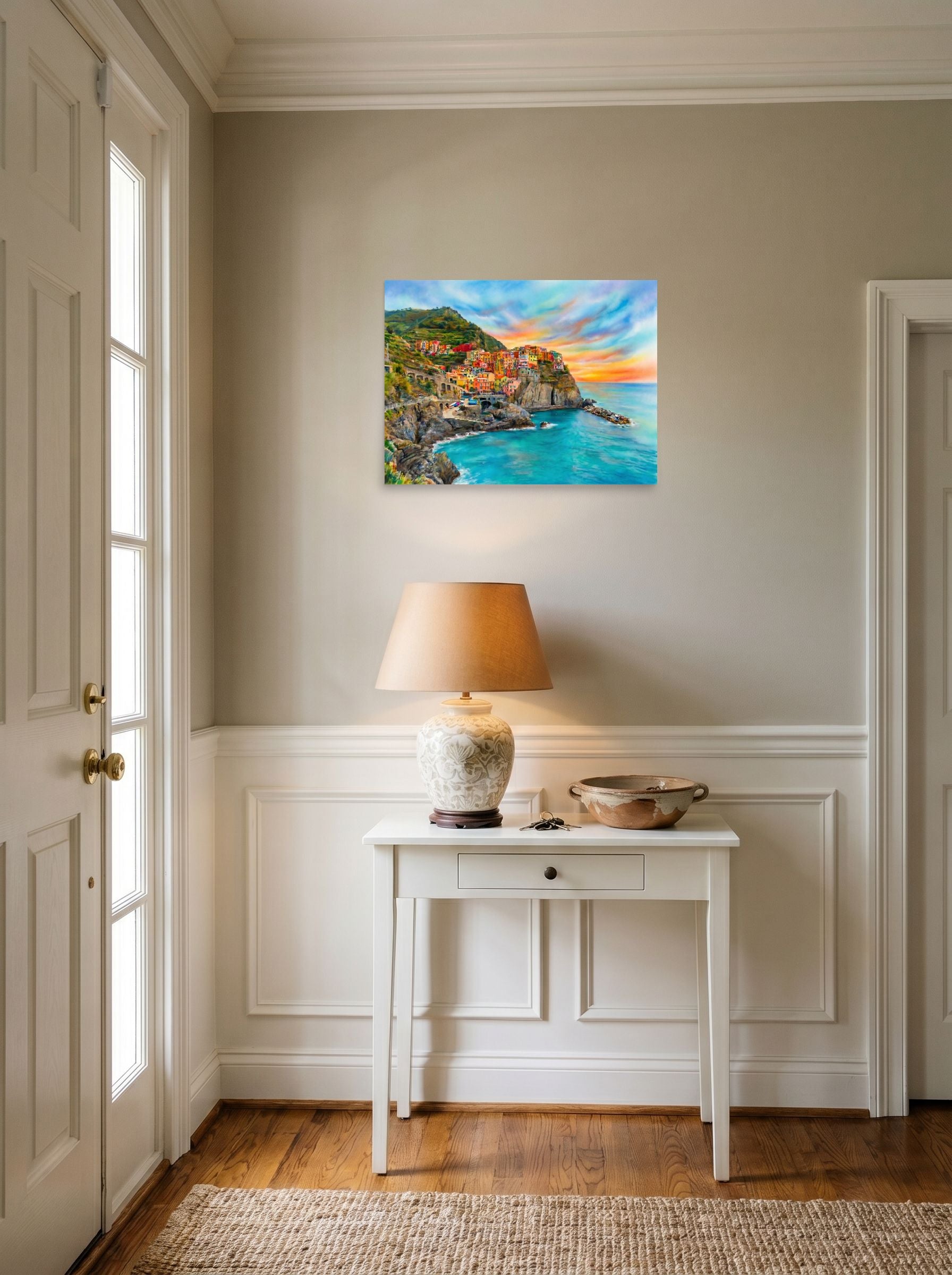 A 24x18 inch unframed paper Realism,Romanticism print of 'Coastal Dreams' hanging in an entryway near a console.