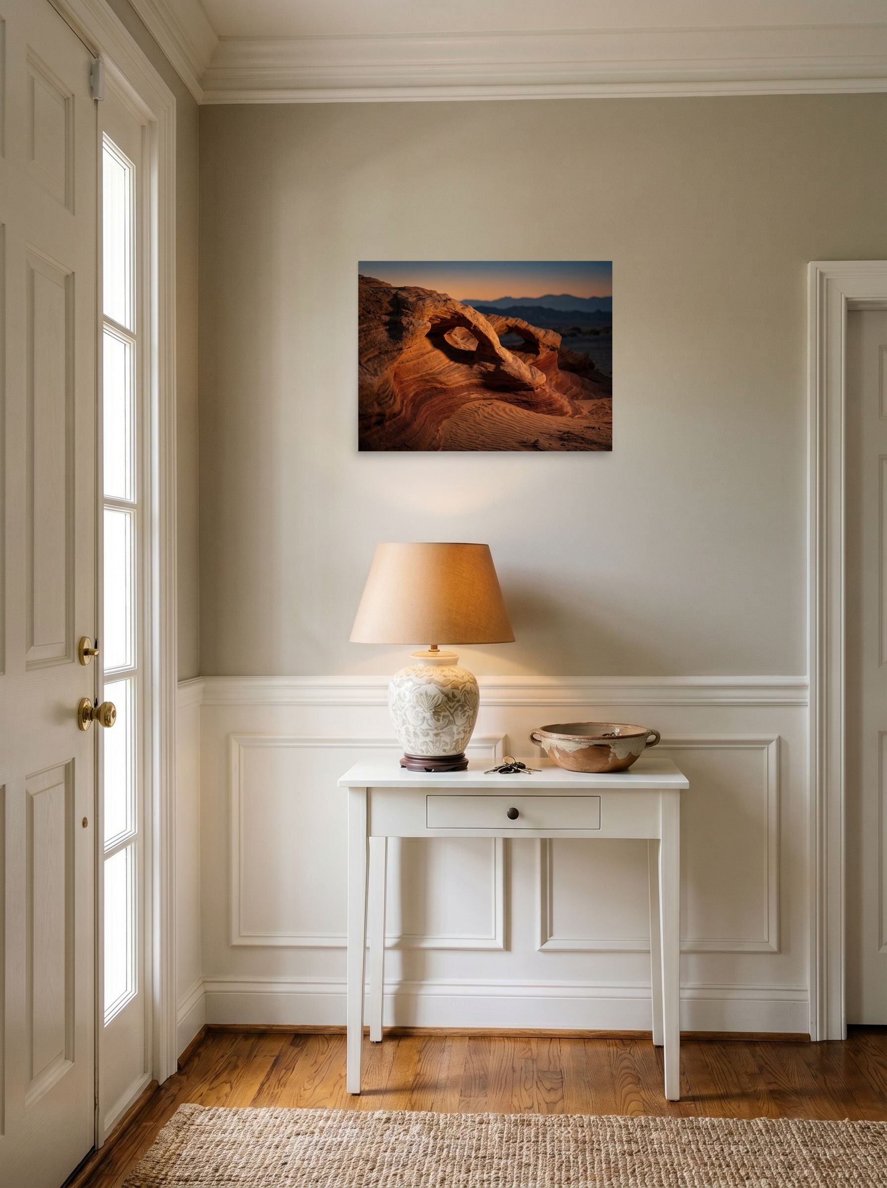 A 24x18 inch unframed paper Art photography print of 'Desert Whispers' hanging in an entryway near a console.