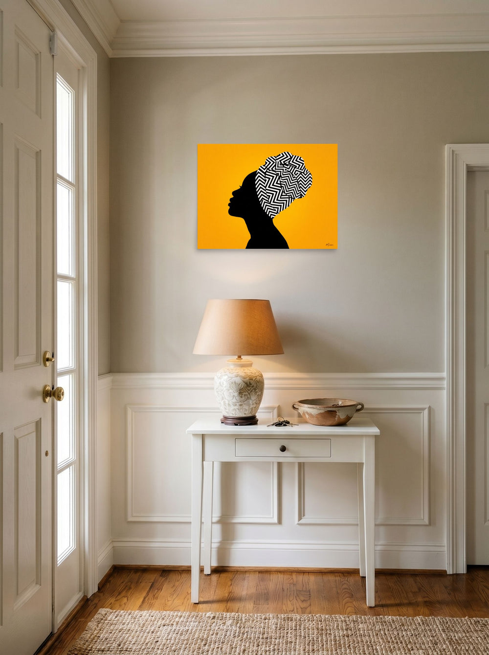 A 24x18 inch unframed paper Afrofuturism,Pop art print of 'Geometric Crown' hanging in an entryway near a console.