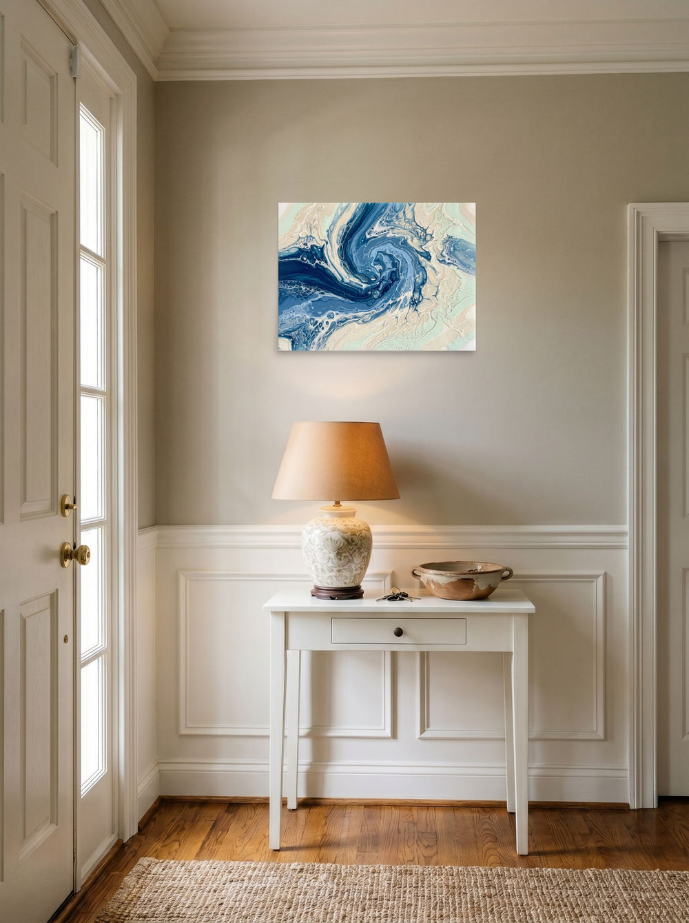 A 24x18 inch unframed paper Abstract art print of 'Ocean Whirlpool' hanging in an entryway near a console.