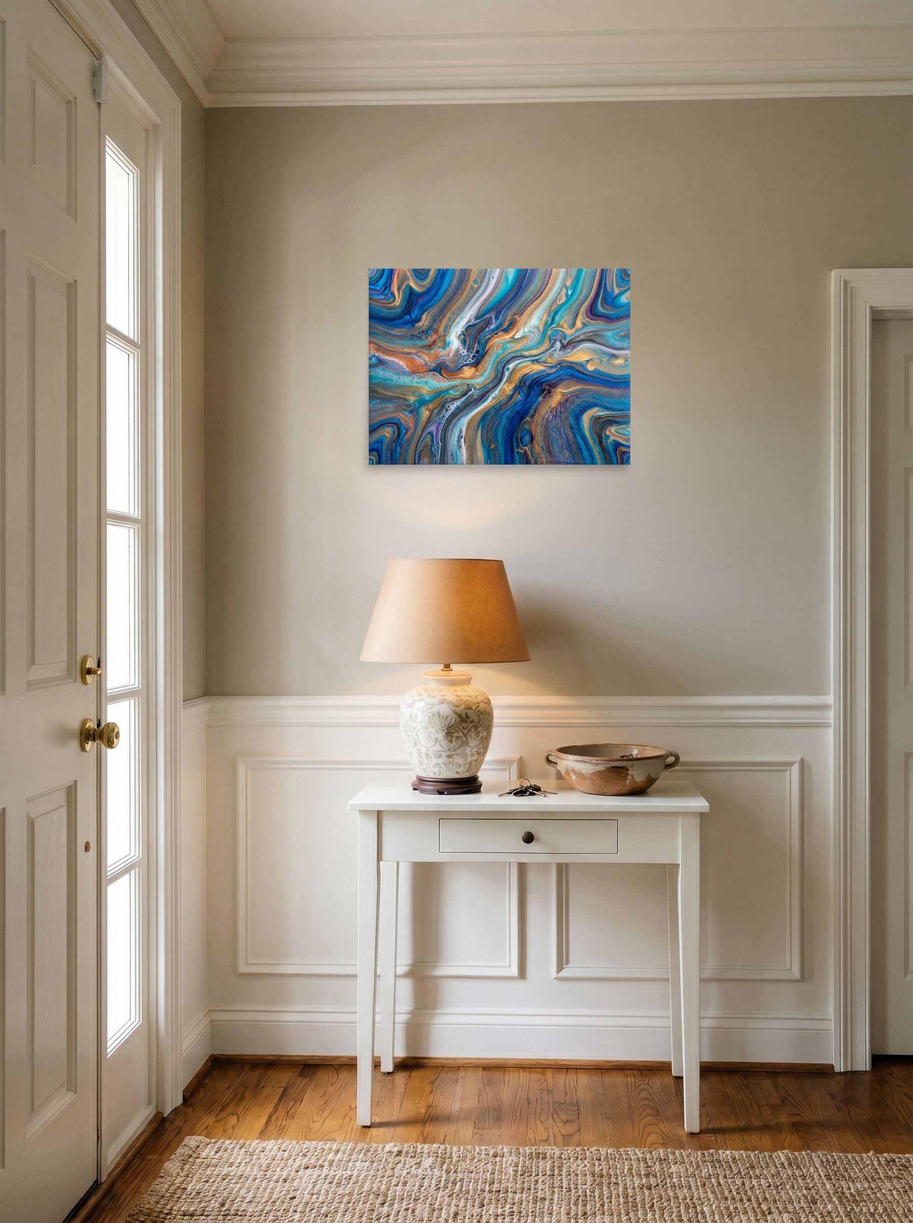 A 24x18 inch unframed paper Abstract art print of 'Sapphire Waves' hanging in an entryway near a console.