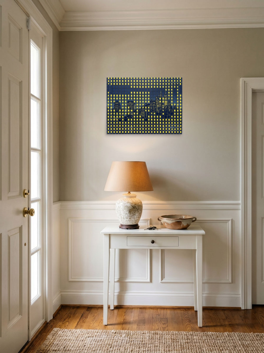 A 24x18 inch unframed paper Pop art print of 'Grid City Nights' hanging in an entryway near a console.
