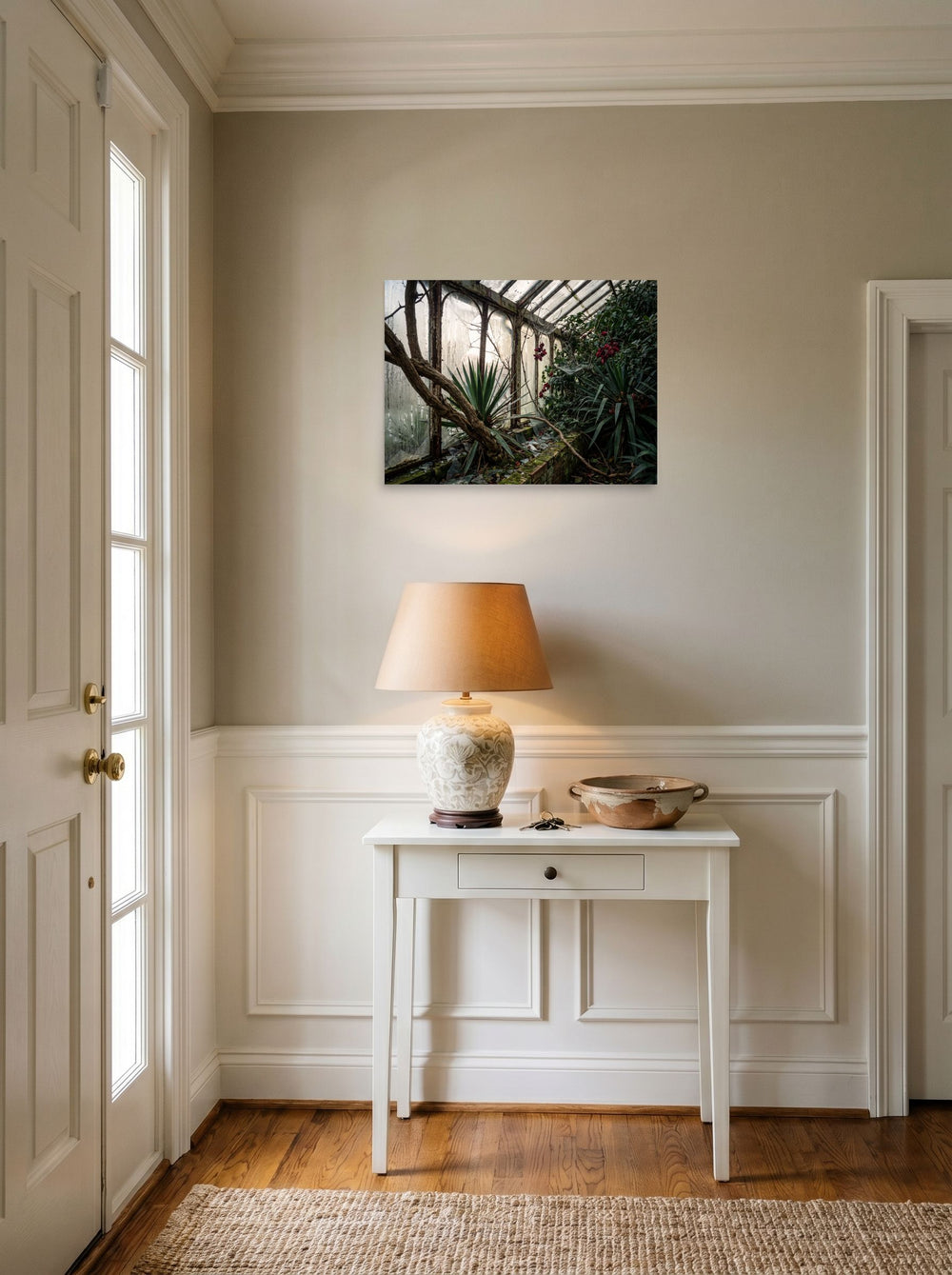 A 24x18 inch unframed paper Art photography print of 'The Overgrown Glasshouse' hanging in an entryway near a console.