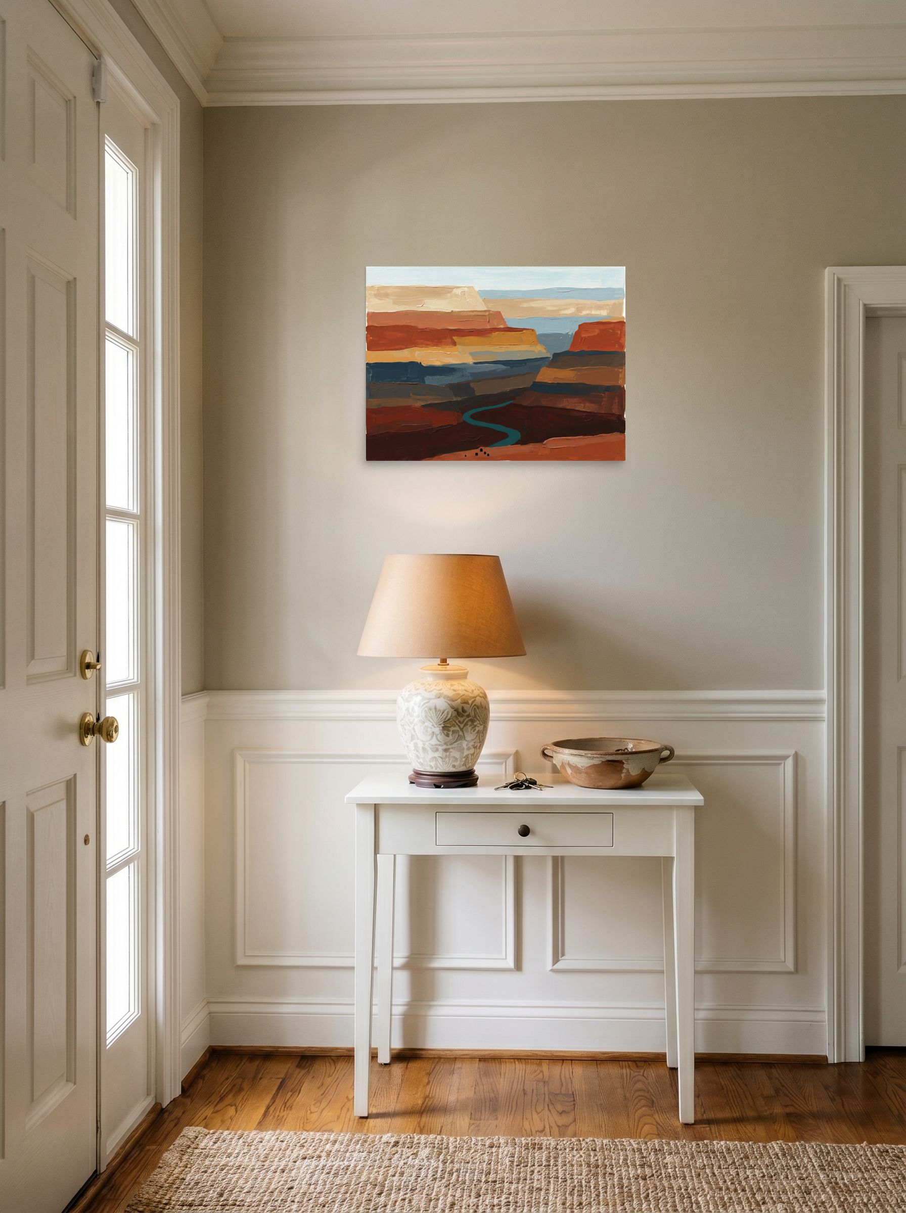 A 24x18 inch unframed paper Expressionism,Impressionism print of 'Deep Canyon River' hanging in an entryway near a console.