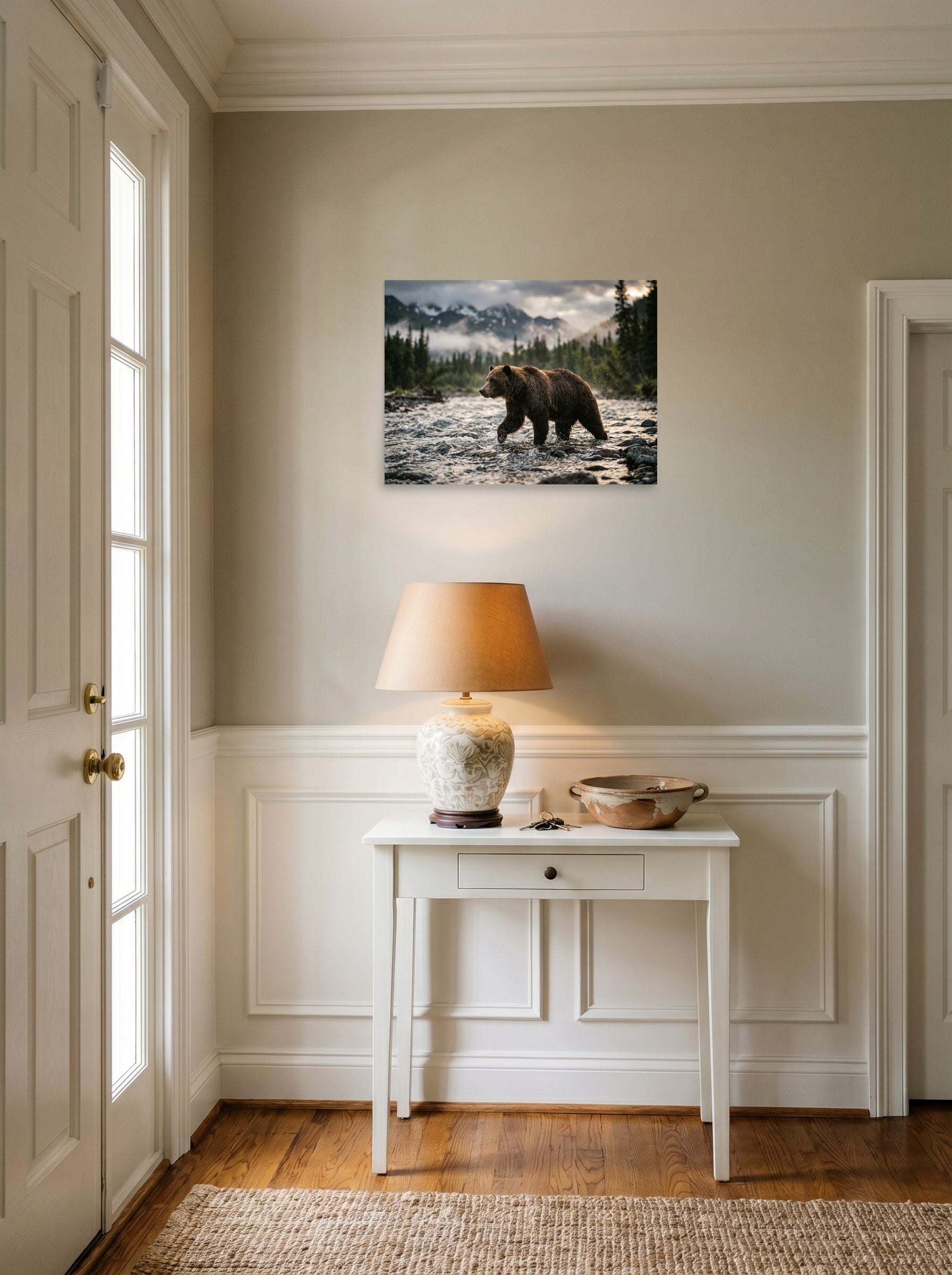 A 24x18 inch unframed paper Art photography print of 'River Crossing' hanging in an entryway near a console.