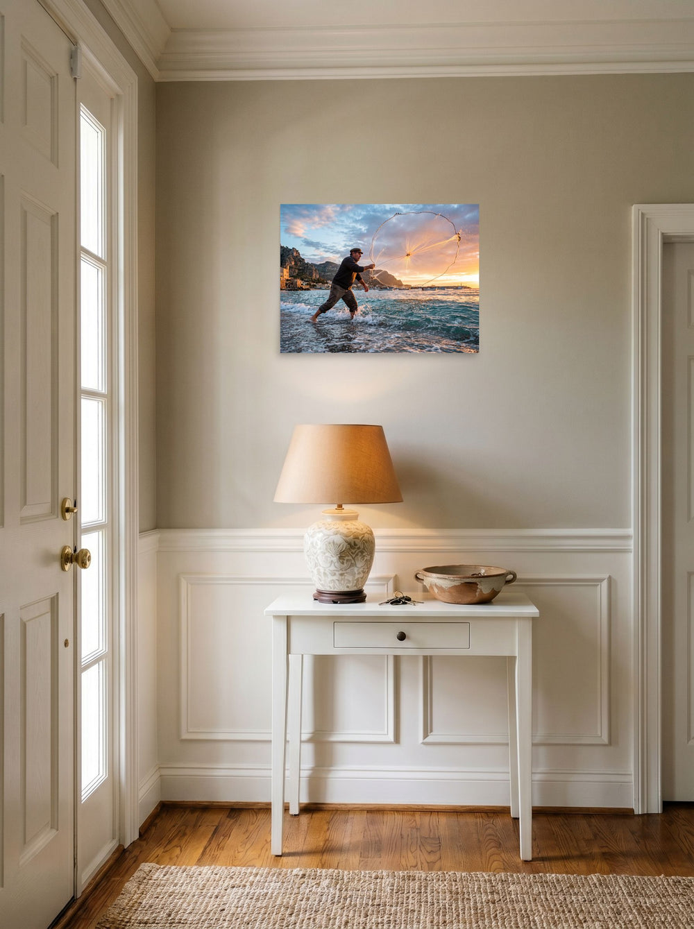 A 24x18 inch unframed paper Art photography print of 'Casting the Dawn' hanging in an entryway near a console.