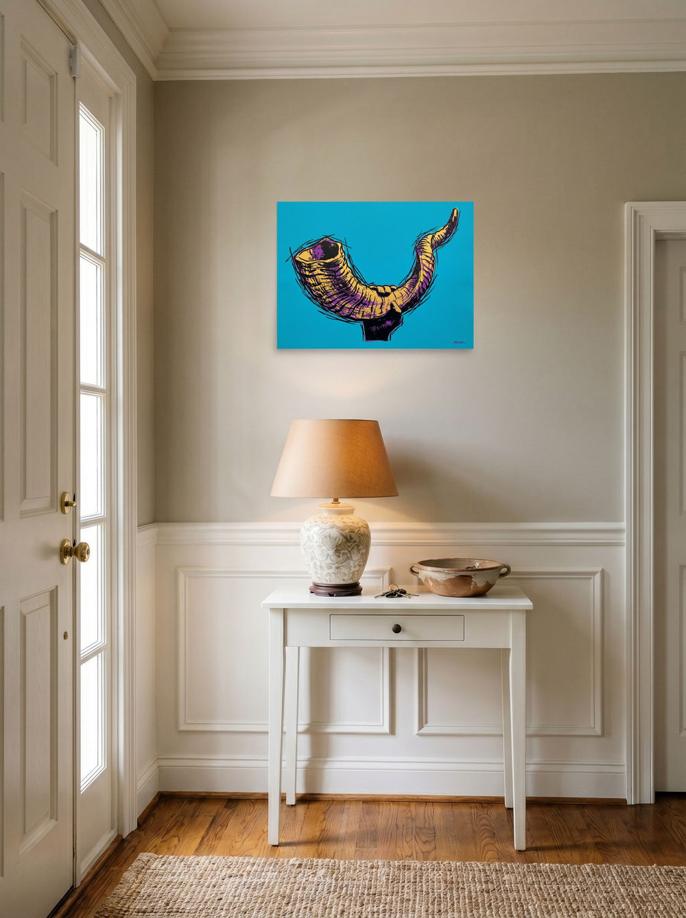A 24x18 inch unframed paper Pop art print of 'The Golden Shofar' hanging in an entryway near a console.