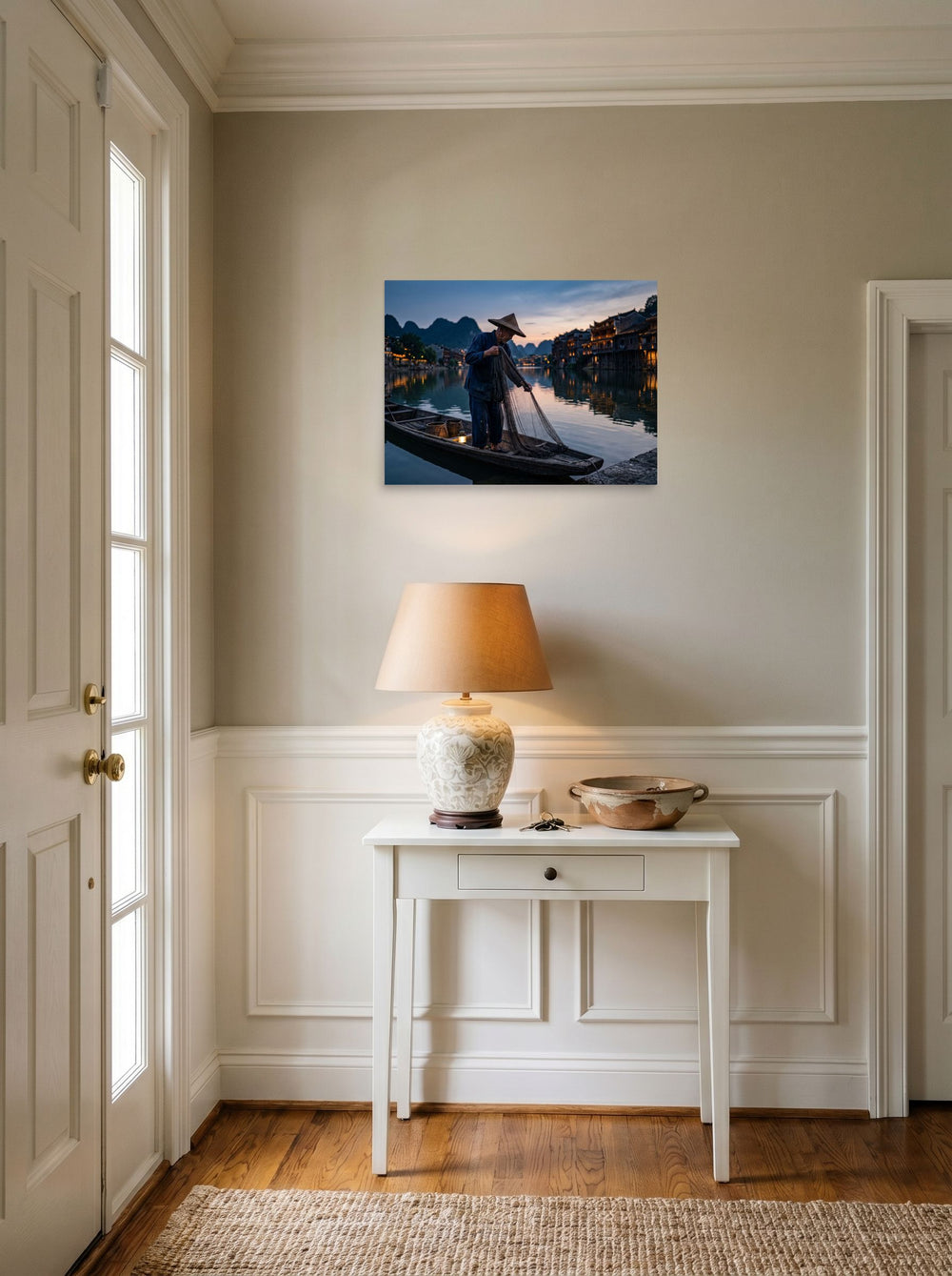 A 24x18 inch unframed paper Art photography print of 'Twilight River' hanging in an entryway near a console.