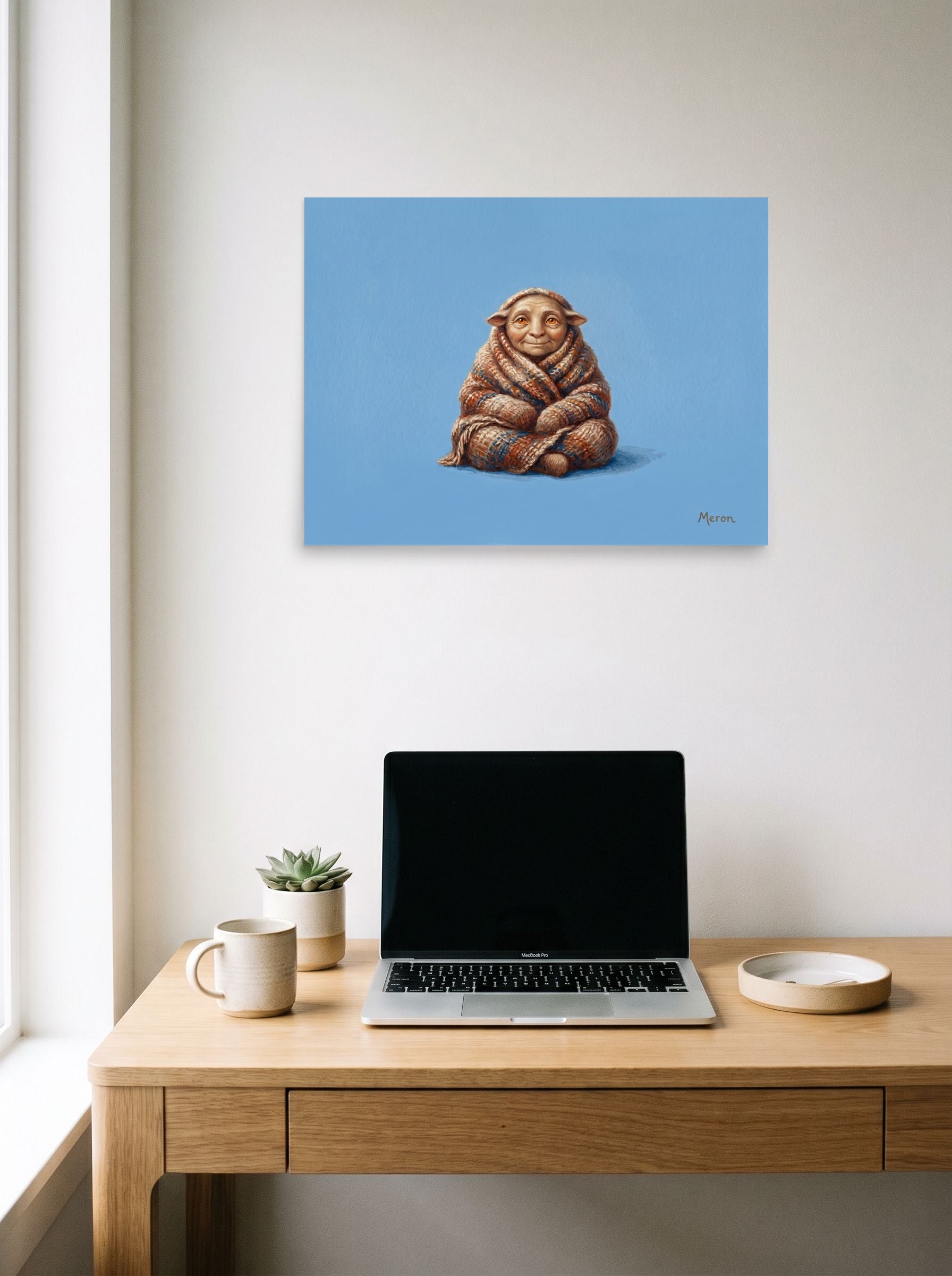 A 24x18 inch unframed paper Figurative art,Magic realism print of 'The Cozy Gnome' hanging above a worktable with a laptop.