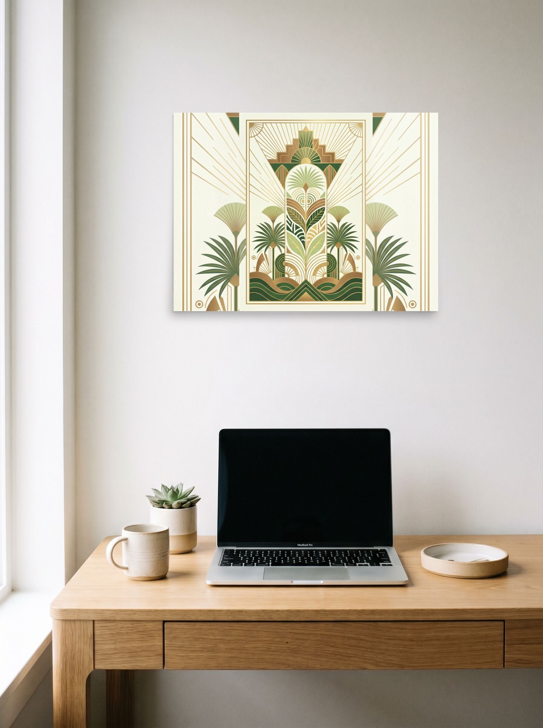 A 24x18 inch unframed paper Art Deco print of 'Golden Palm Deco' hanging above a worktable with a laptop.