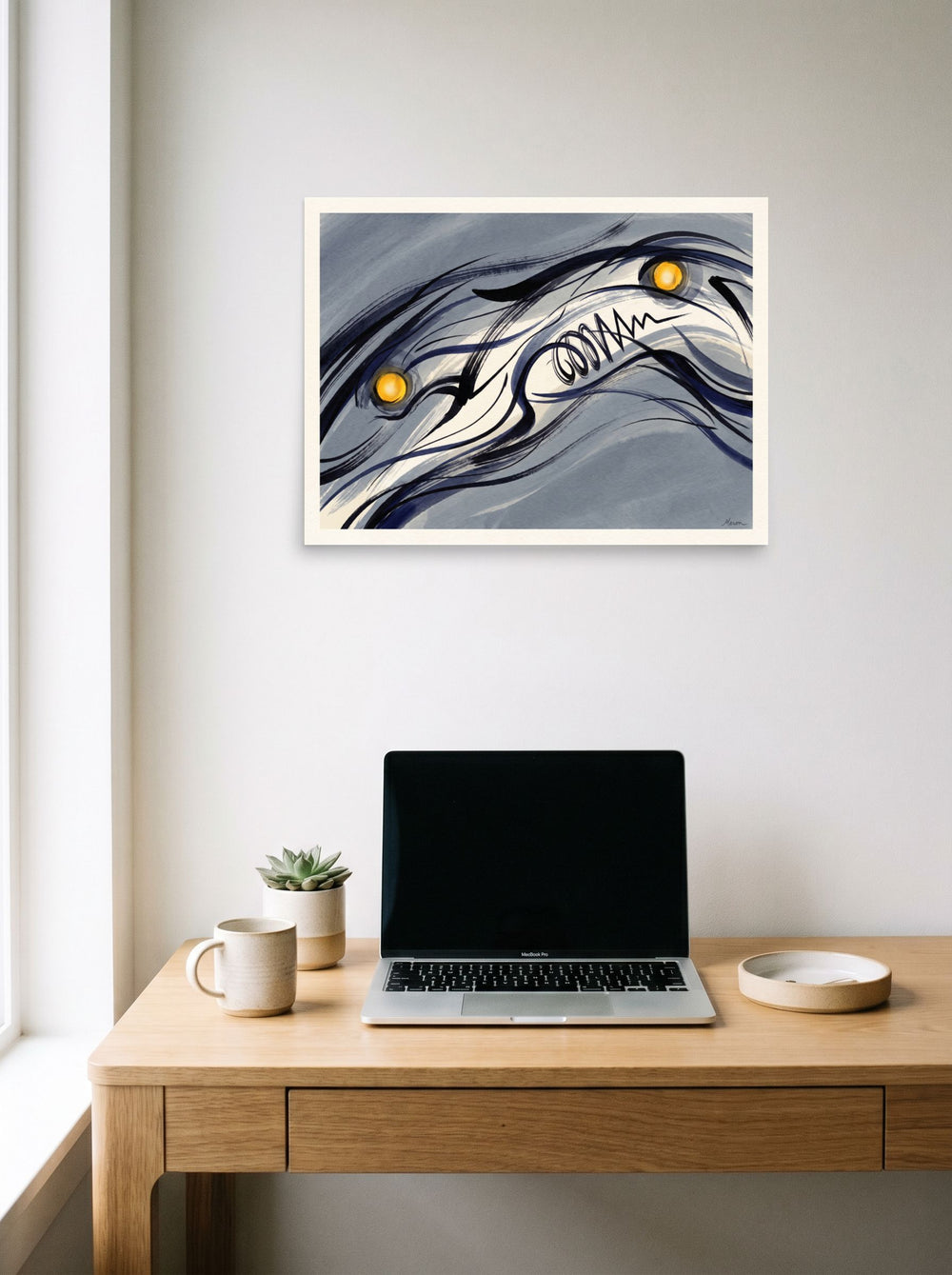 A 24x18 inch unframed paper version of 'Celestial Currents', Abstract art wall art, hanging above a worktable with a laptop.
