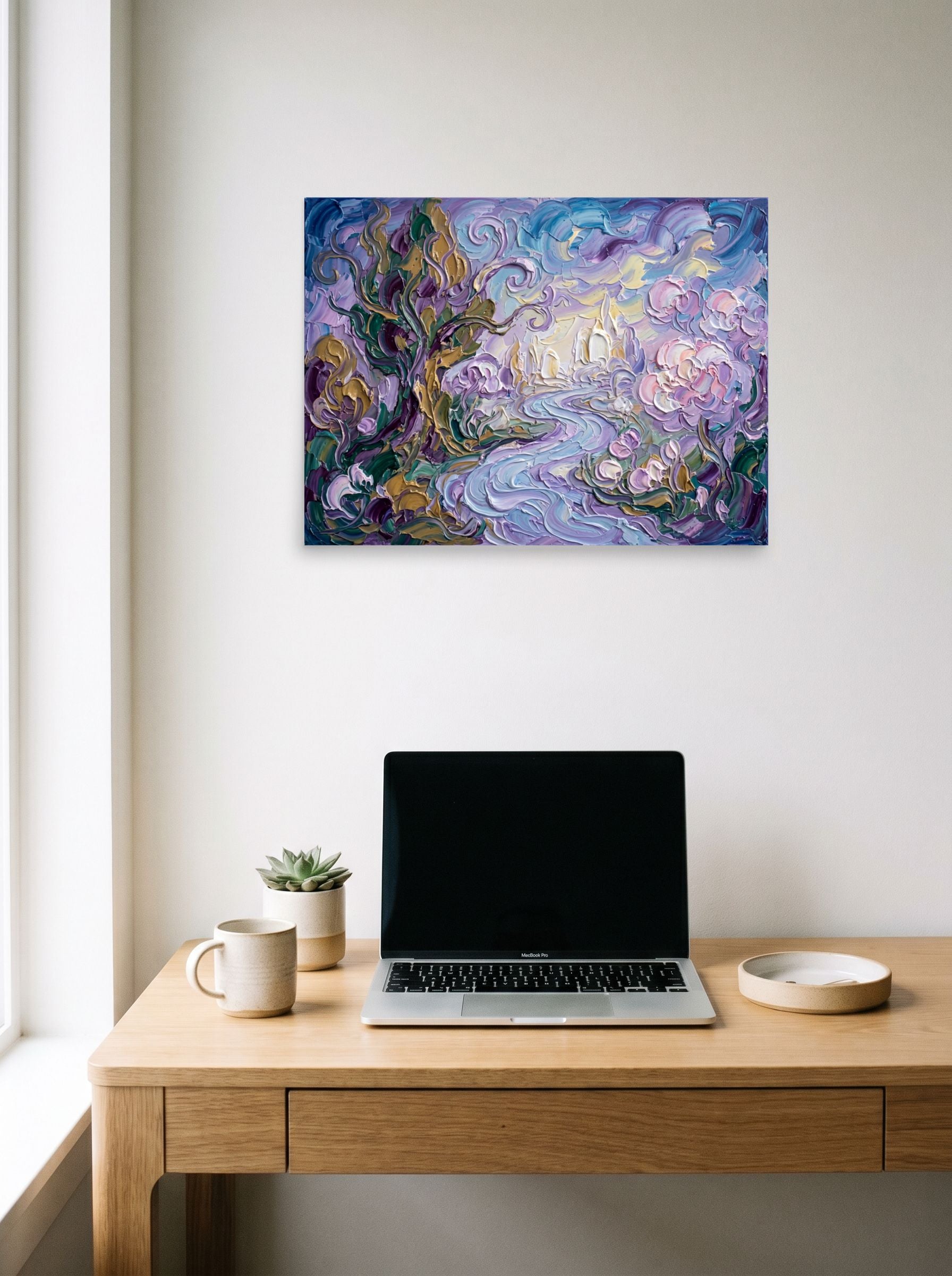 A 24x18 inch unframed paper Post-Impressionism print of 'Lavender Dreamscape' hanging above a worktable with a laptop.
