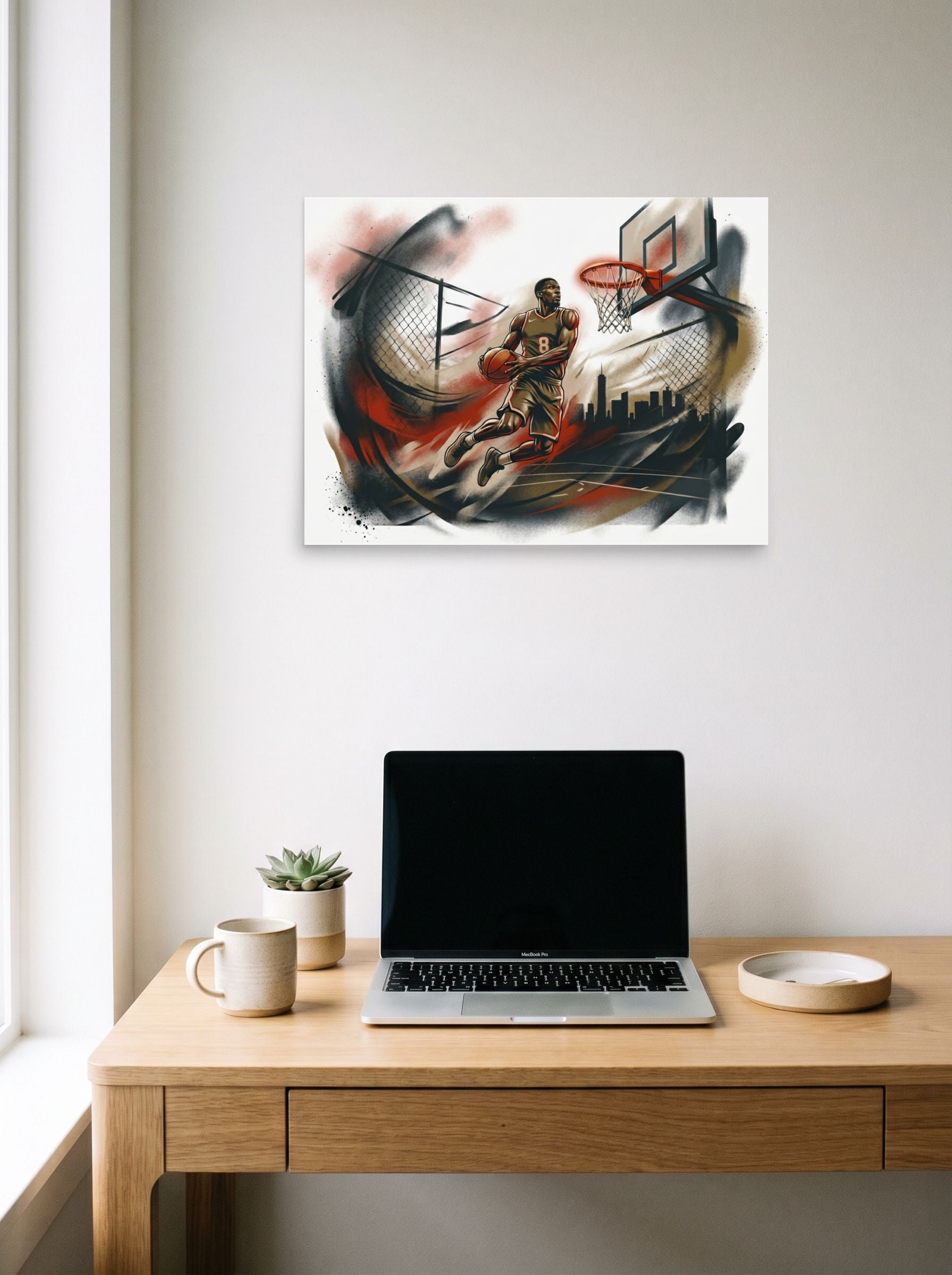 A 24x18 inch unframed paper Figurative art print of 'The Final Dunk' hanging above a worktable with a laptop.