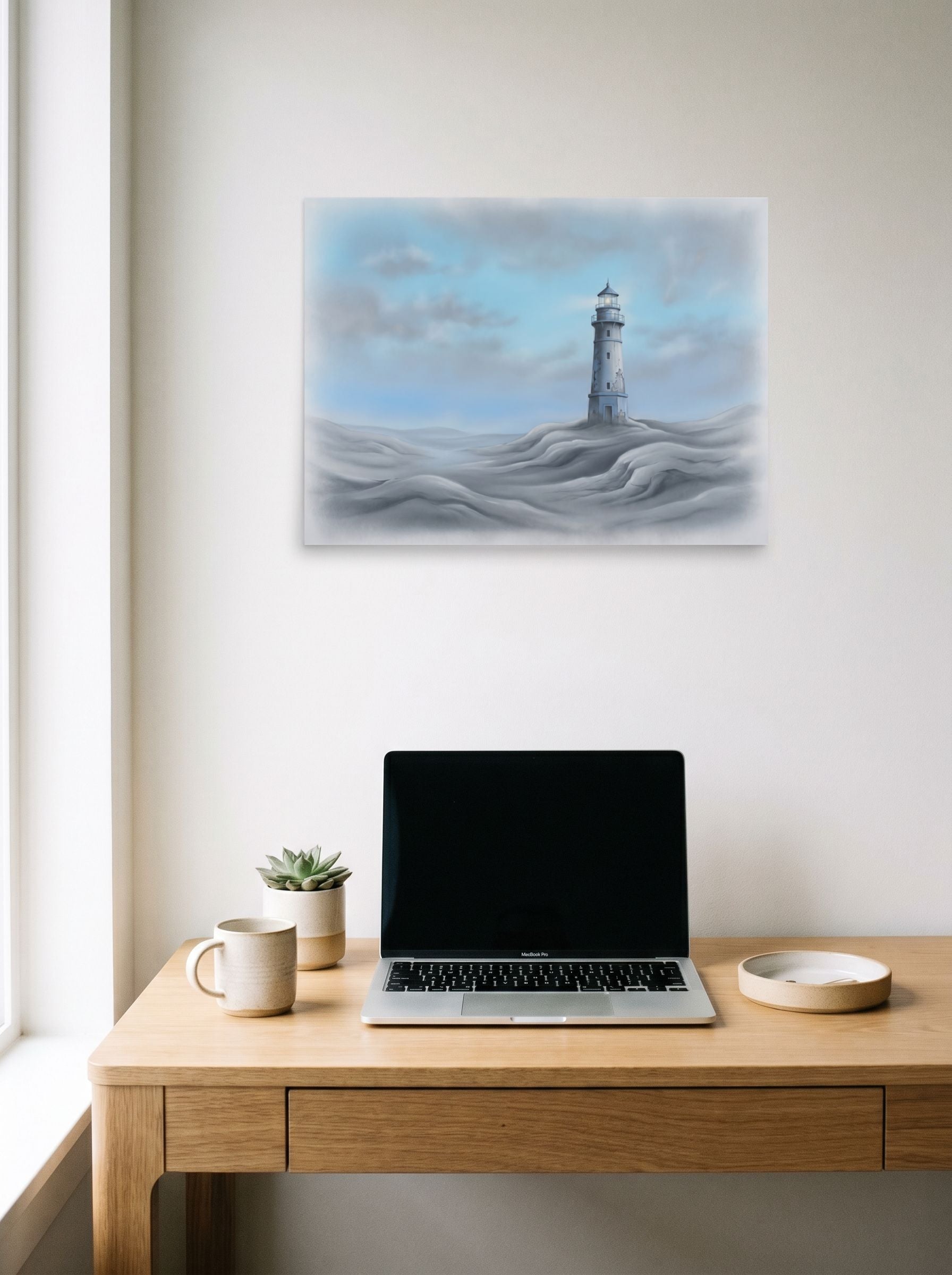 A 24x18 inch unframed paper Realism print of 'The Silent Beacon' hanging above a worktable with a laptop.