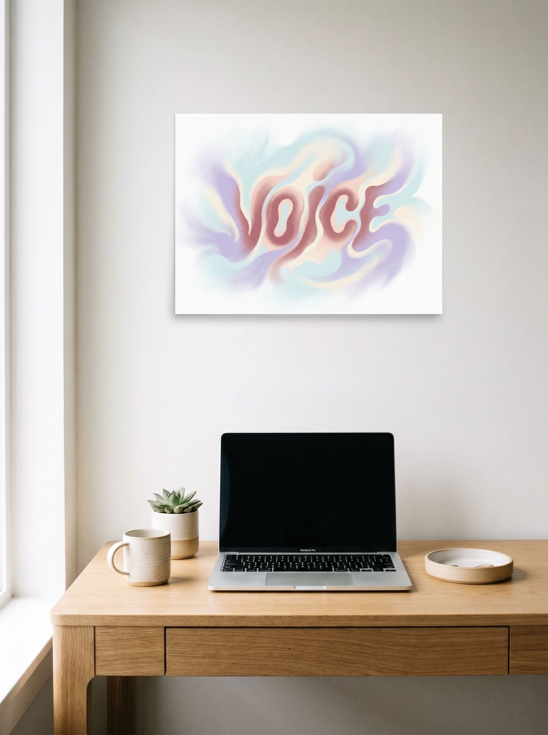 A 24x18 inch unframed paper Pop art,Abstract art print of 'Echoes of Voice' hanging above a worktable with a laptop.