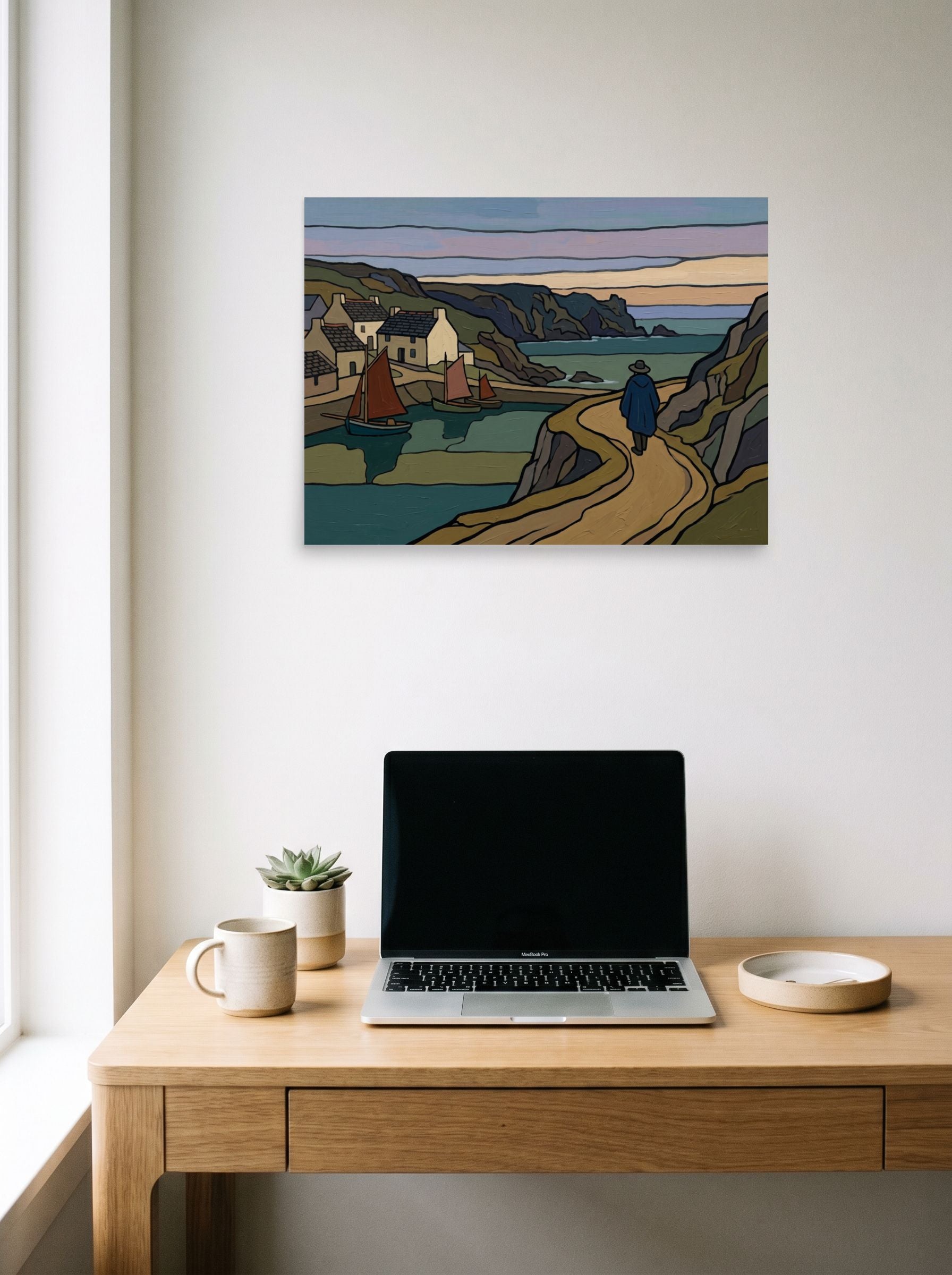 A 24x18 inch unframed paper Cloisonnism print of 'The Winding Coastal Path' hanging above a worktable with a laptop.