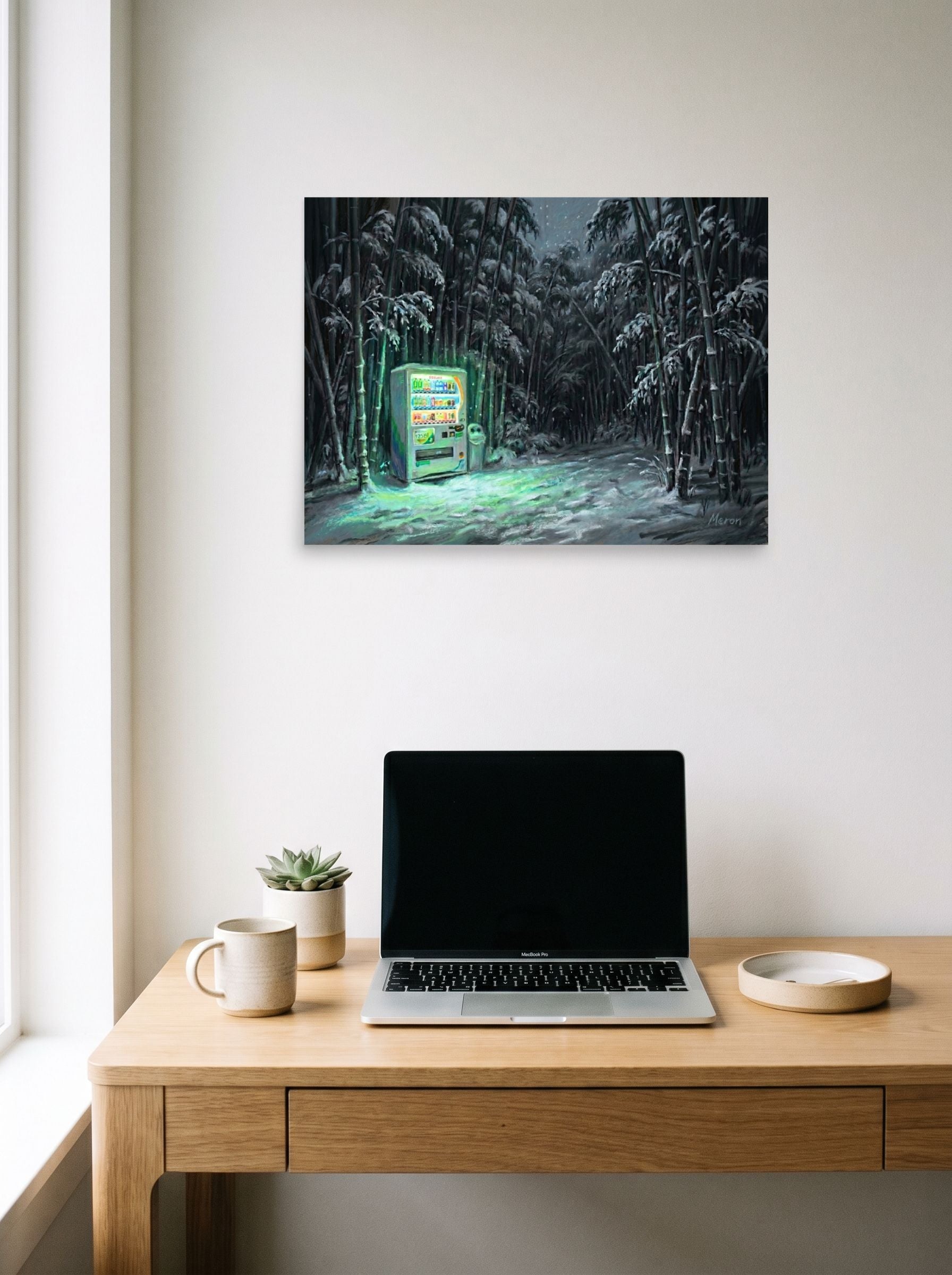 A 24x18 inch unframed paper Magic realism print of 'Midnight Glow in the Grove' hanging above a worktable with a laptop.