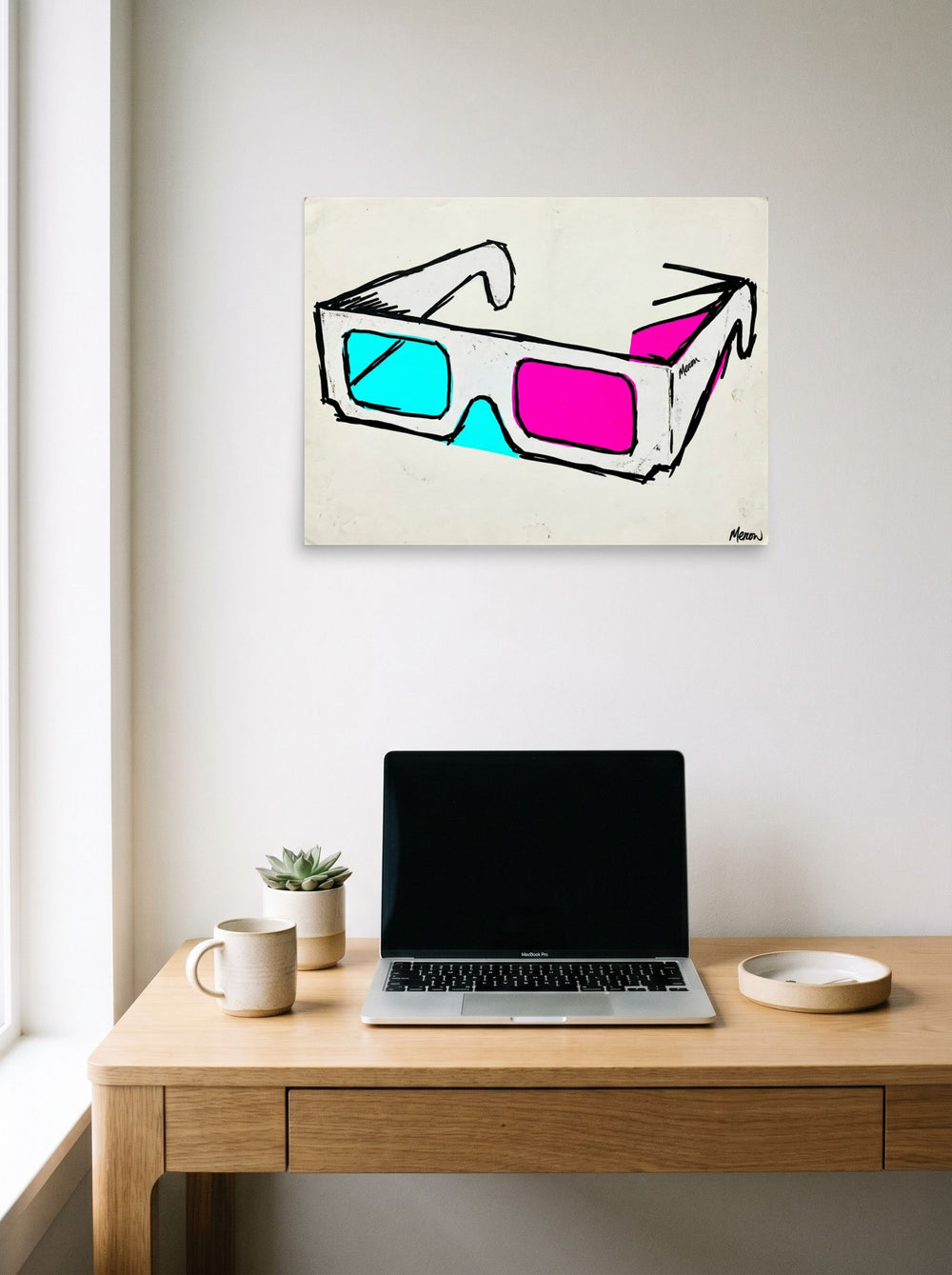 A 24x18 inch unframed paper Pop art print of 'Retro Vision' hanging above a worktable with a laptop.