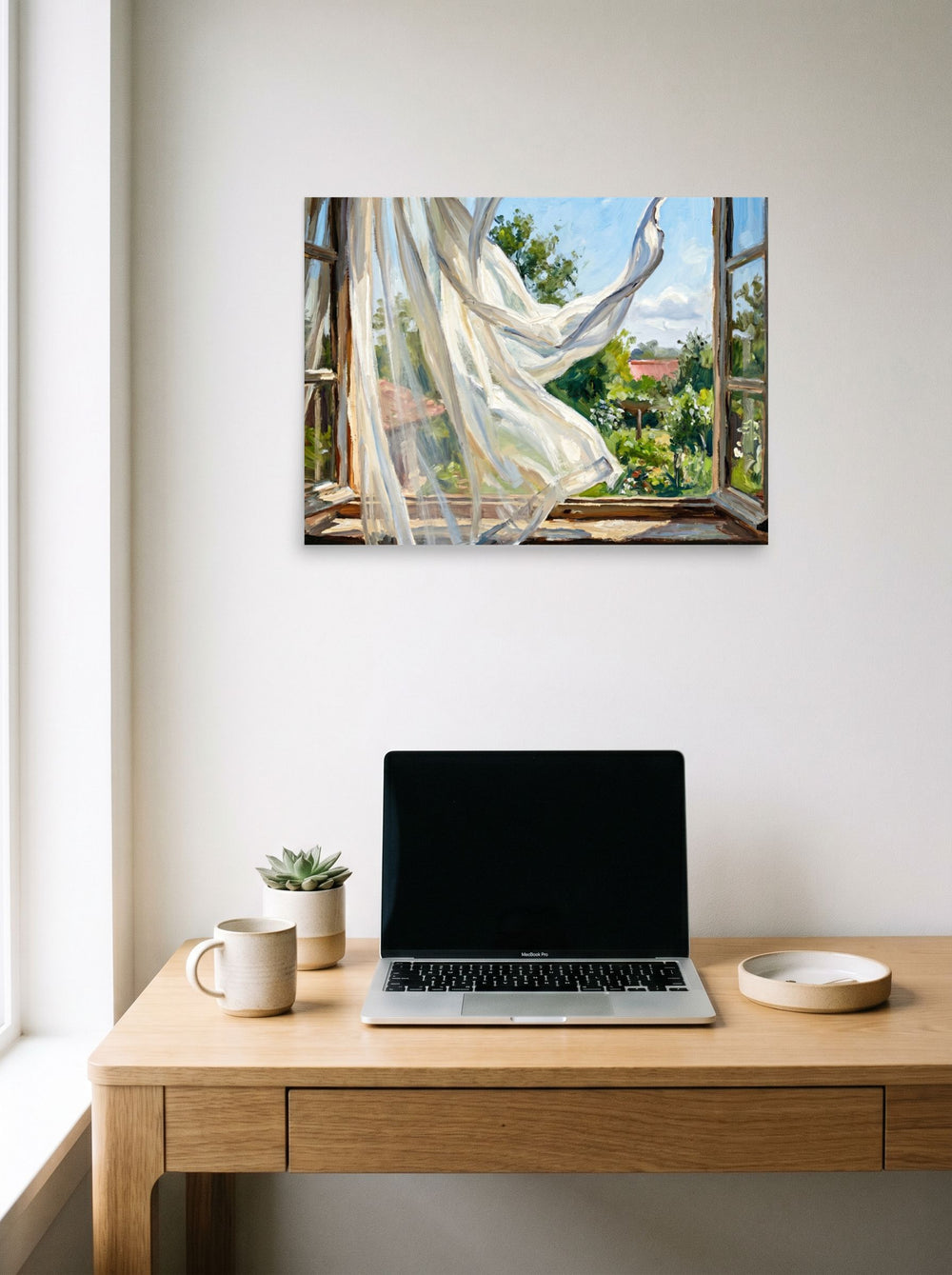 A 24x18 inch unframed paper Impressionism,Plein Air print of 'The Open Window' hanging above a worktable with a laptop.