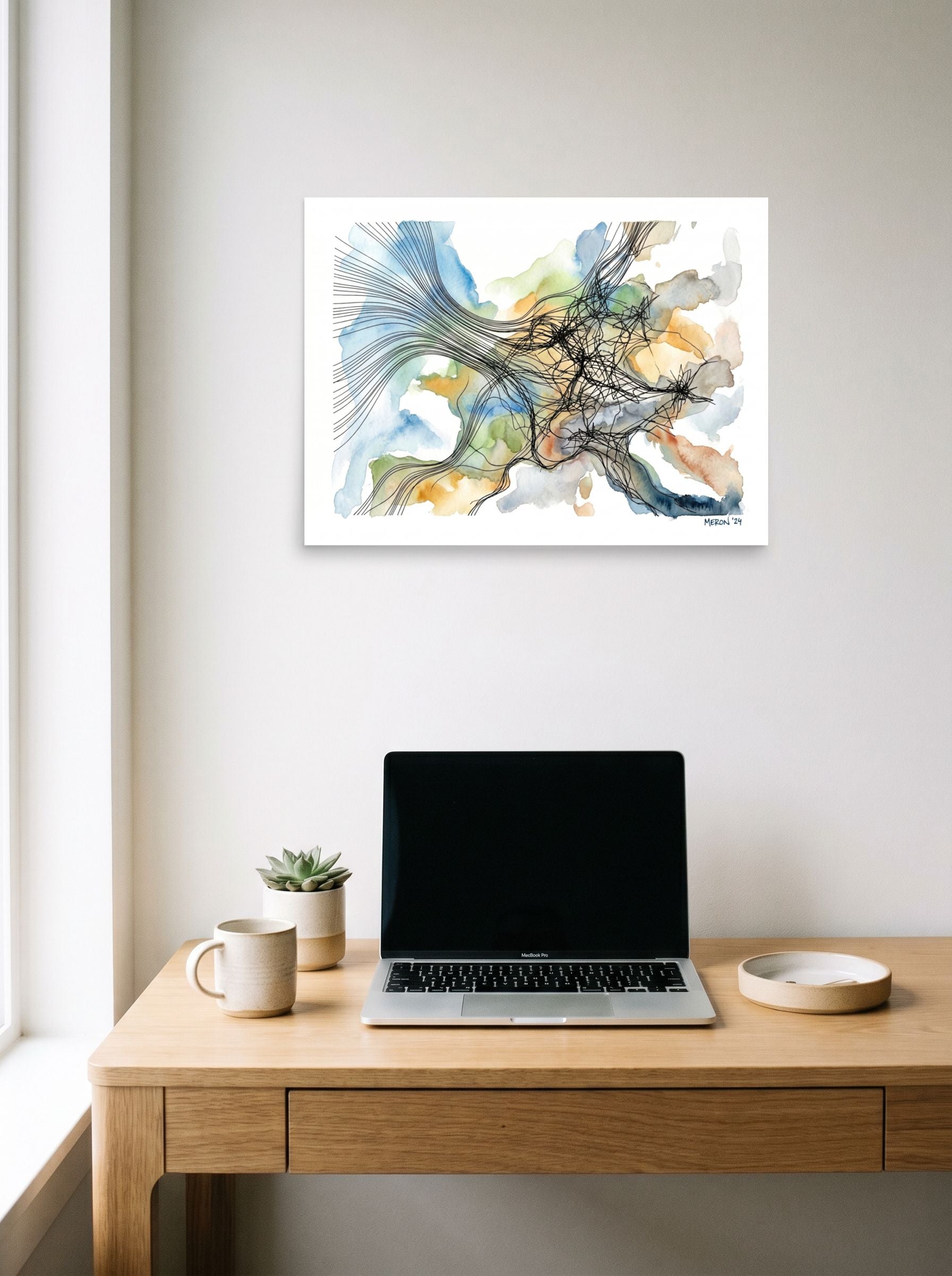 A 24x18 inch unframed paper Abstract art,Abstract expressionism print of 'Tangled Currents' hanging above a worktable with a laptop.