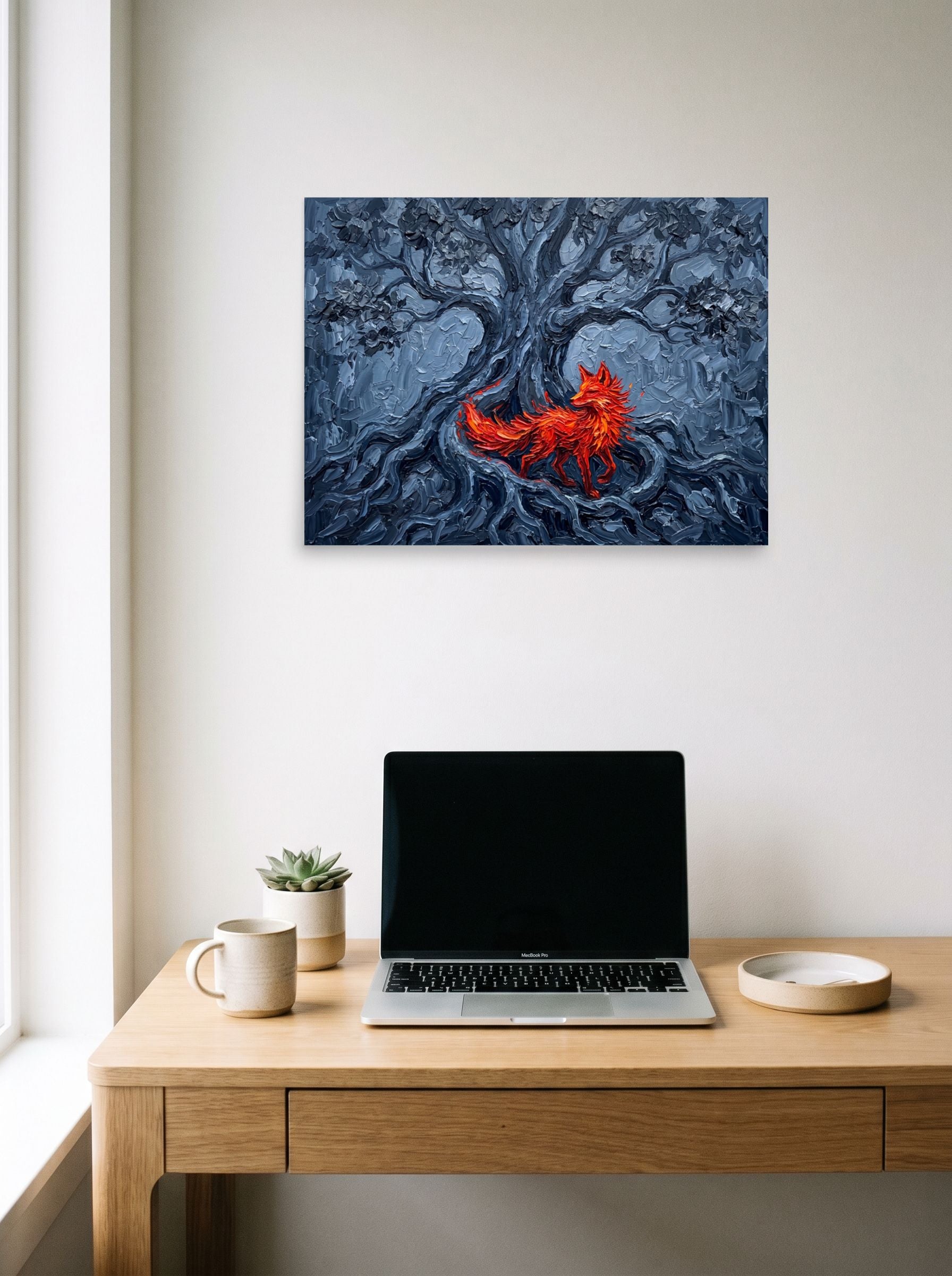 A 24x18 inch unframed paper Expressionism print of 'The Fox in the Shadows' hanging above a worktable with a laptop.